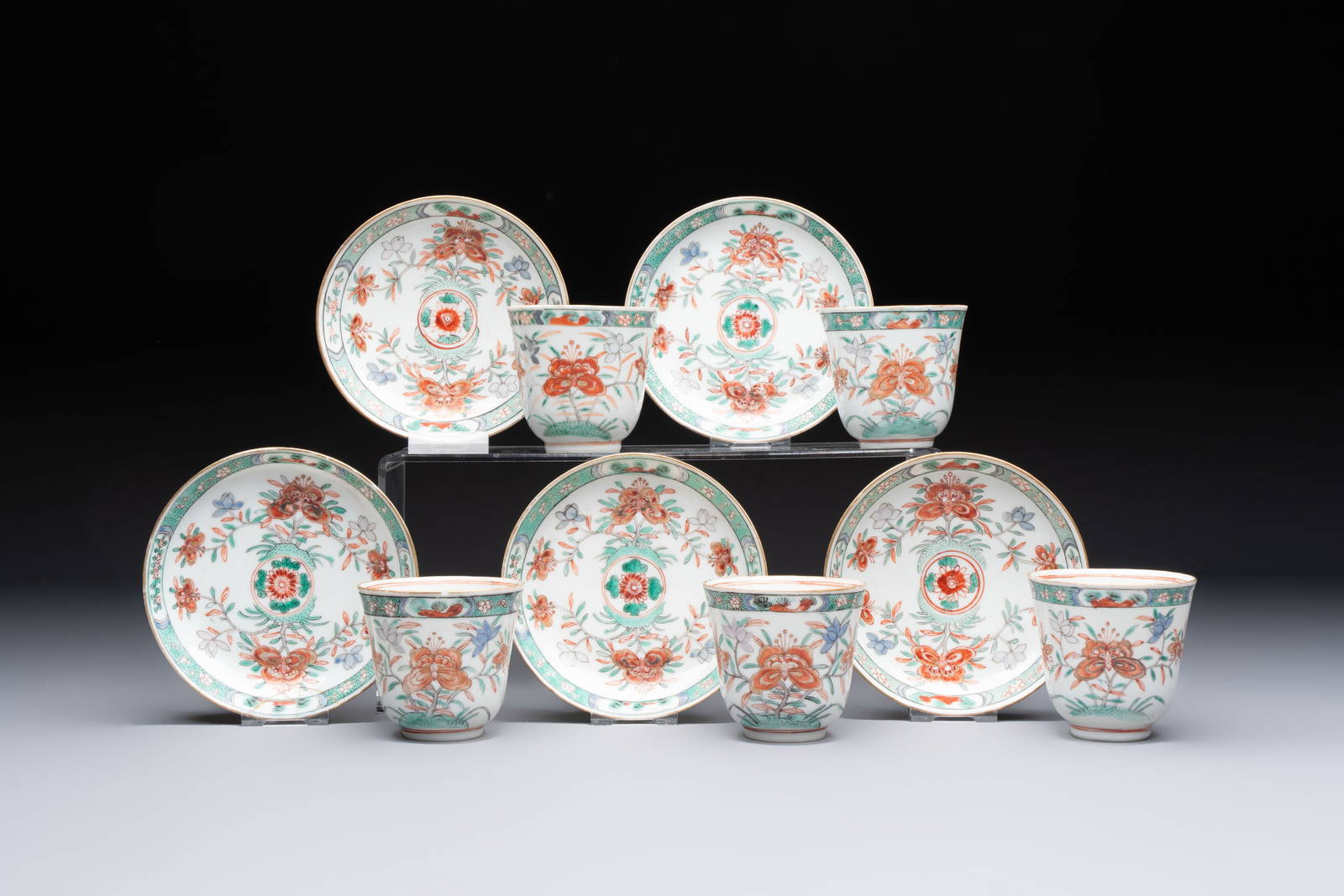 Five Chinese famille verte cups and saucers with floral design, 19th C.