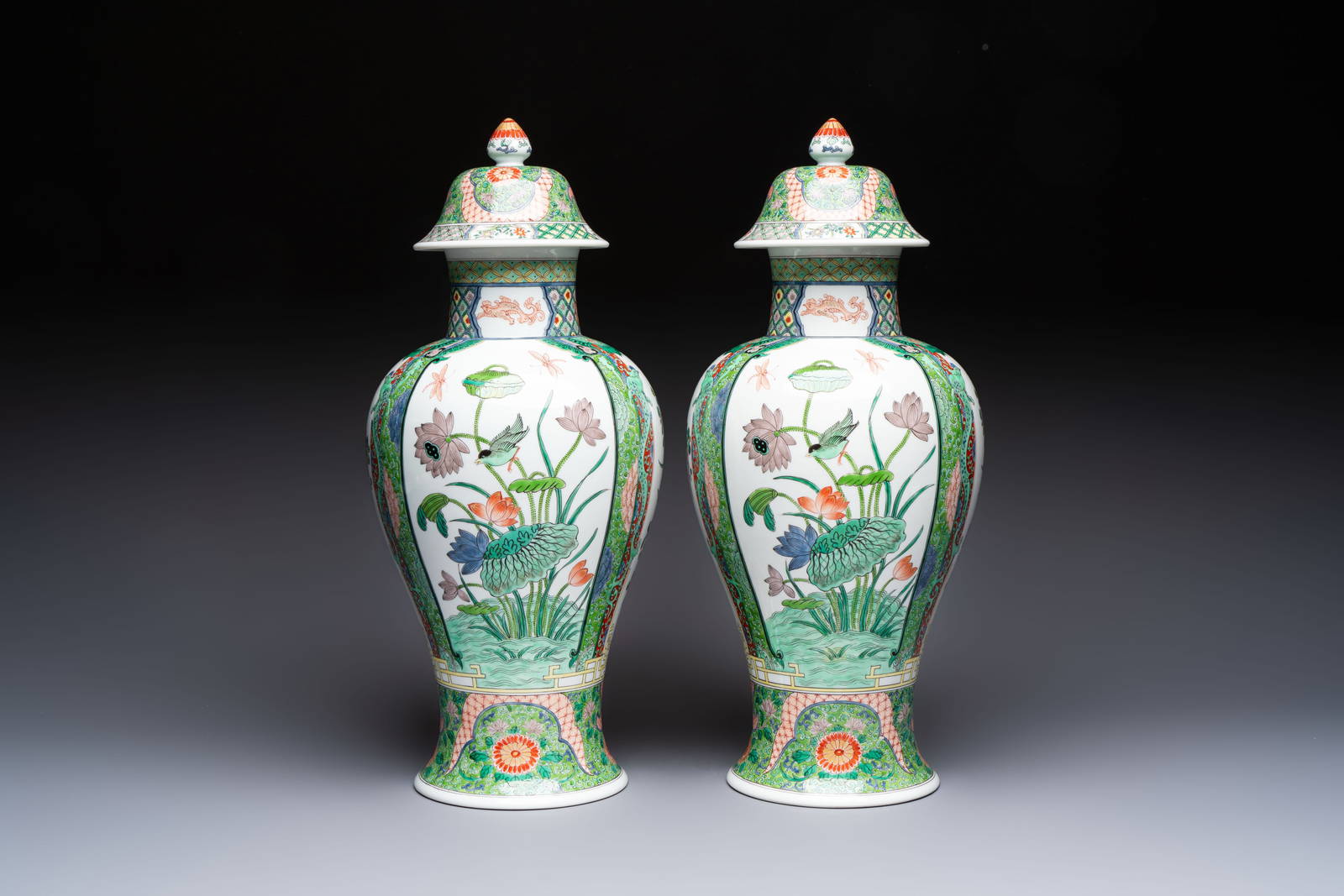 A pair of famille verte-style 'Lotus Pond and Flower Basket' vases and covers, Samson, Paris, 19th