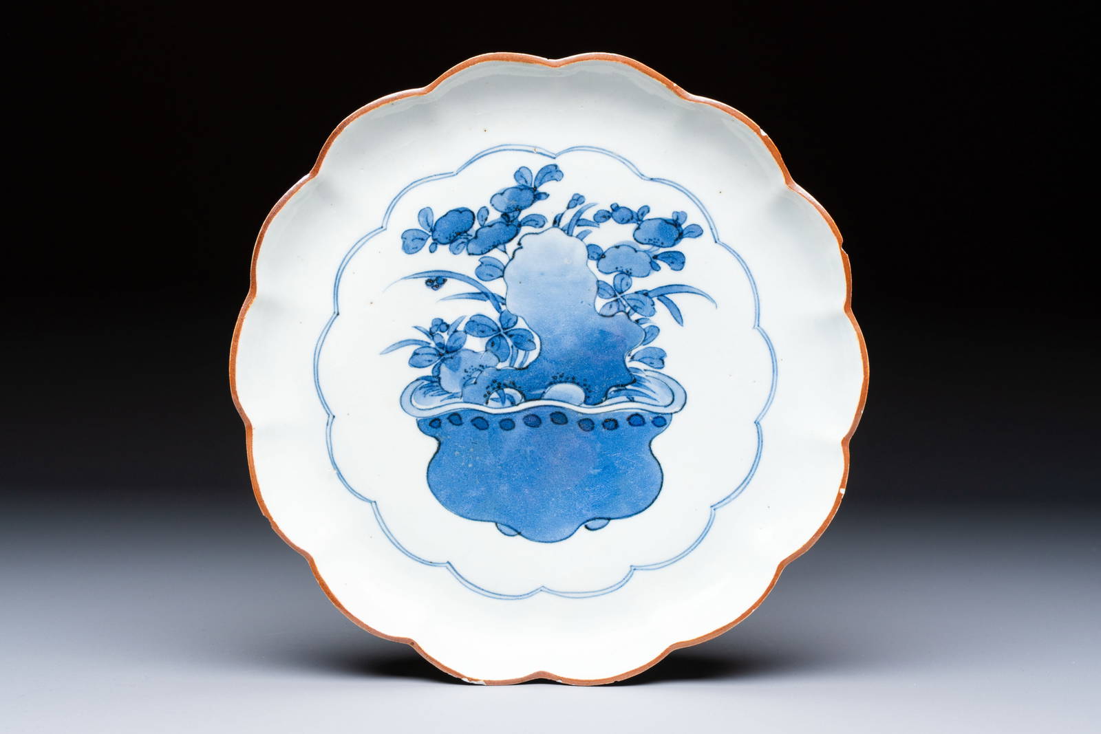 A Japanese Arita blue and white 'Bonsai' plate, Fuku mark, Edo, 17th C.
