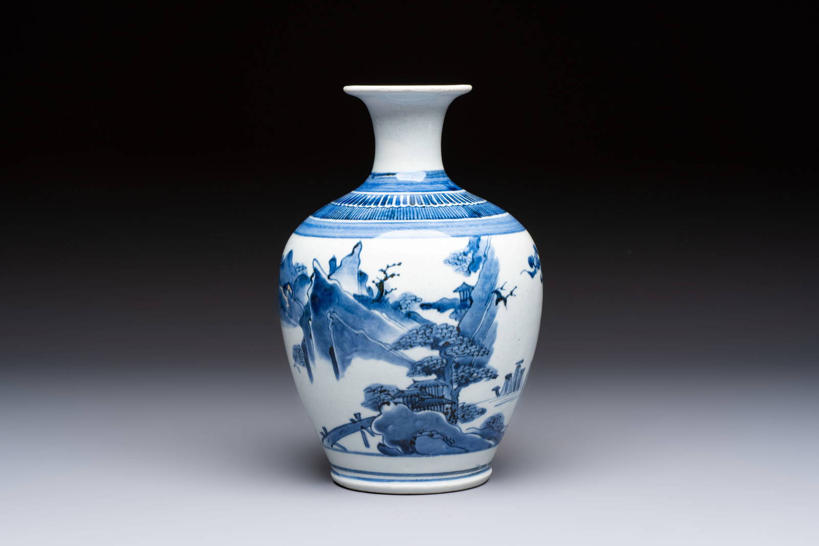 A fine Japanese Arita blue and white vase or sake bottle with landscape design, Edo, ca. 1680