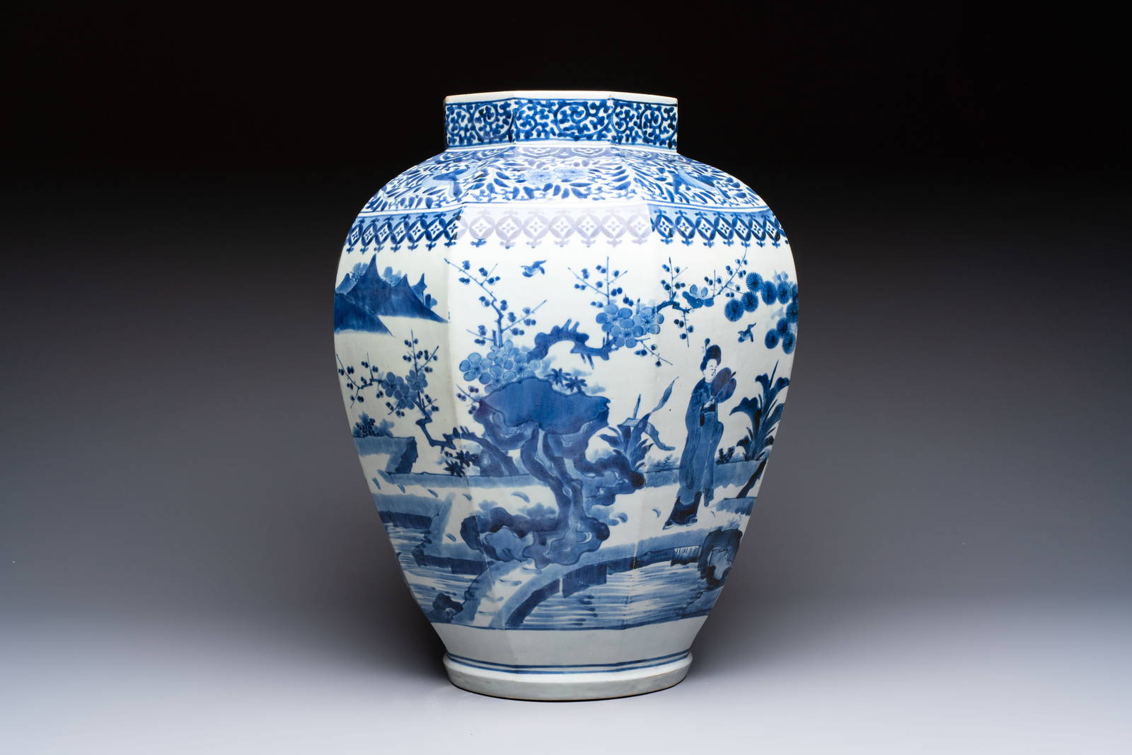 A large Japanese Arita blue and white octagonal vase with figural design, Edo, 17/18th C.