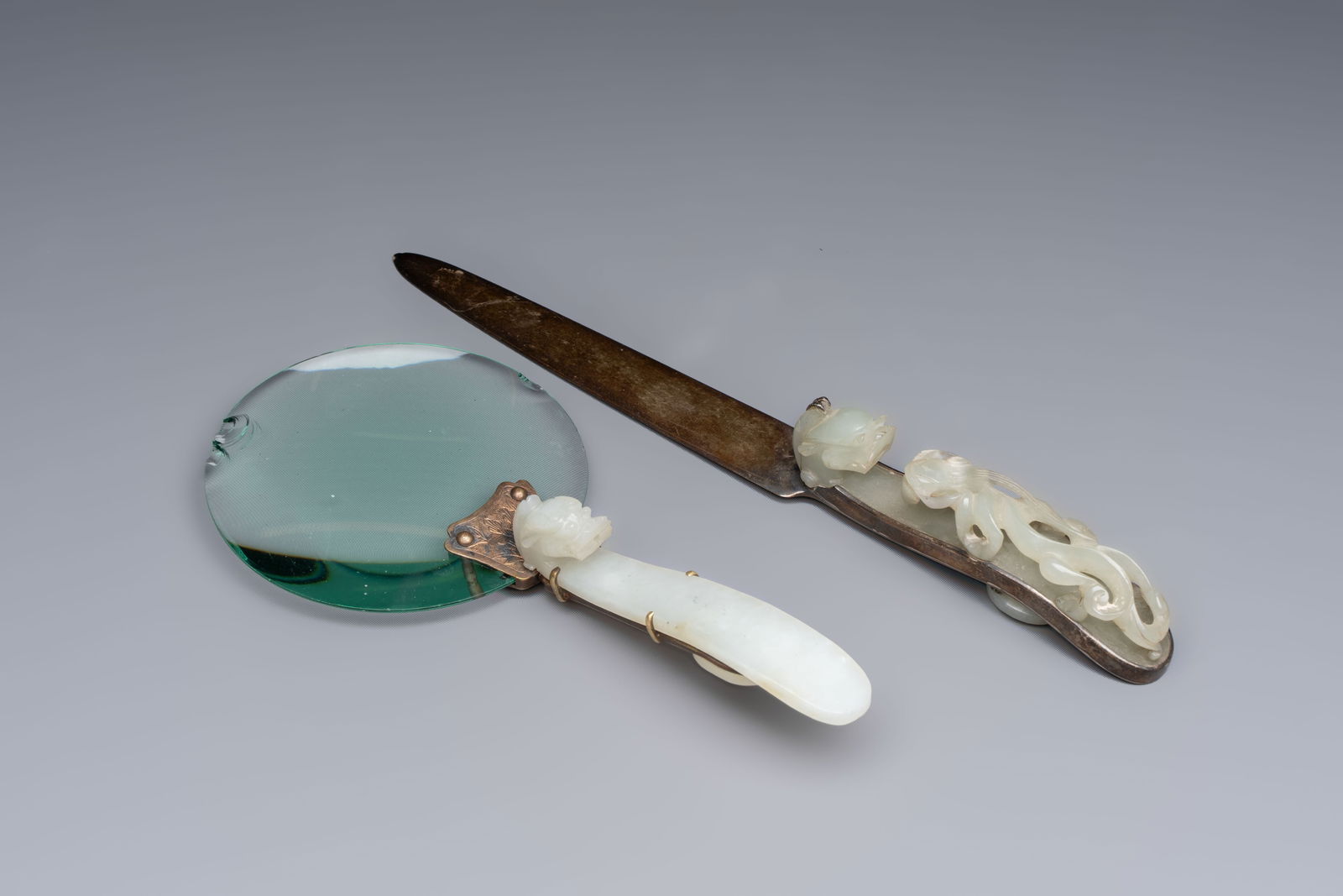 A Chinese mounted magnifying glass with a jade handle and a sterling silver letter opener with a (1 of 6)