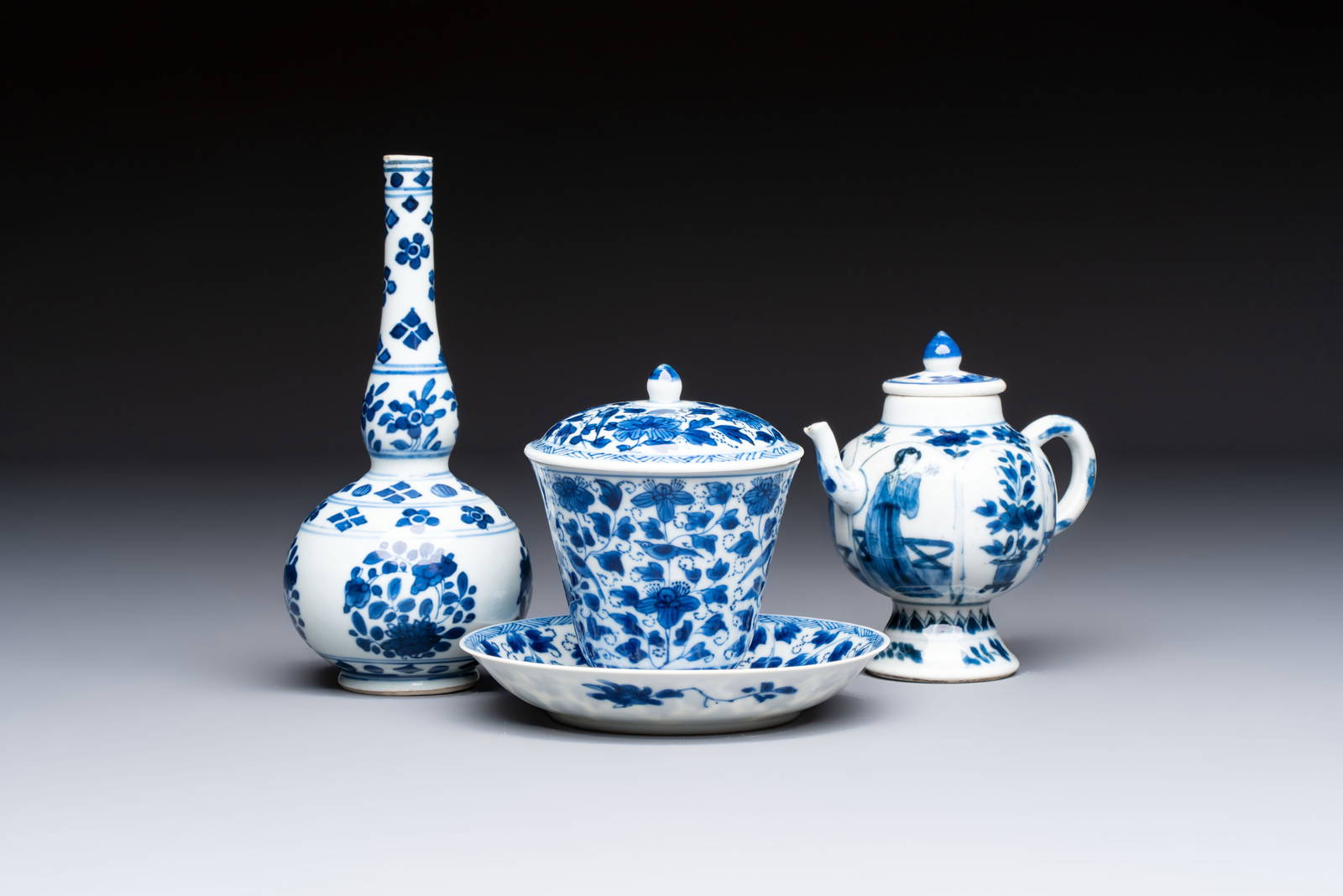 A Chinese blue and white covered ewer, a rose water sprinkler, a covered cup and saucer, jade and
