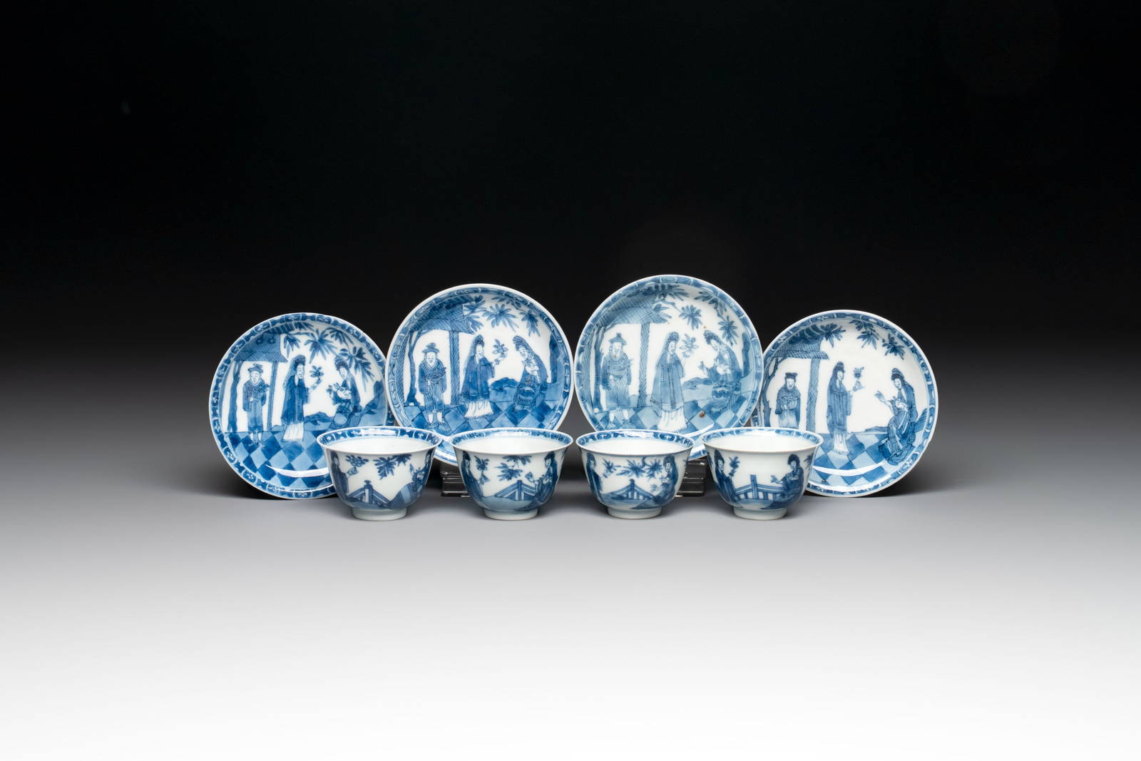 A set of four Chinese blue and white 'Sense of Smell' cups and saucers, artemisia leaf mark, Kangxi