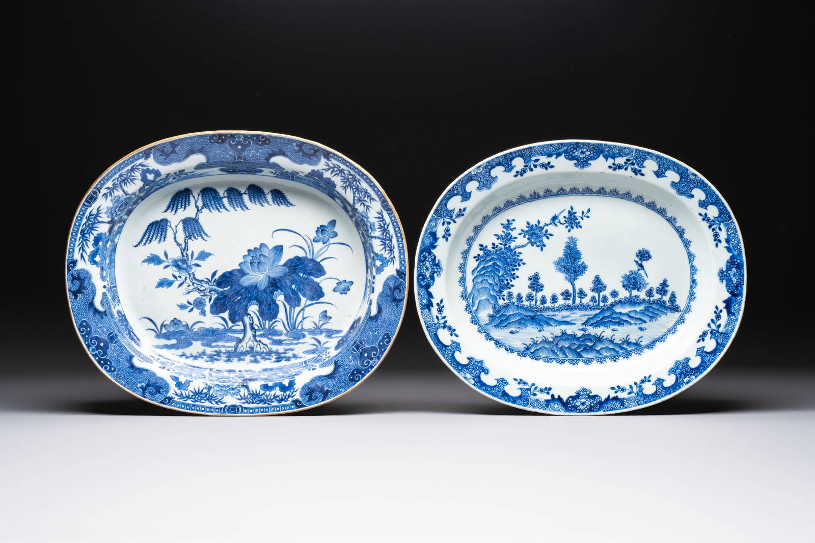 Two Chinese blue and white chargers with floral and landscape design, Qianlong