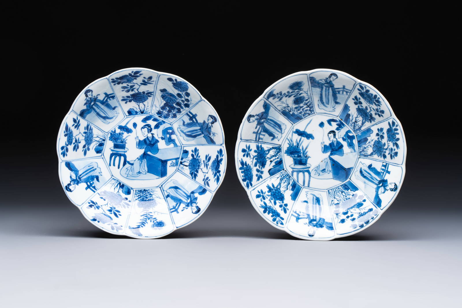 A pair of Chinese blue and white flower-shaped 'Long Eliza' plates, jade mark, Kangxi