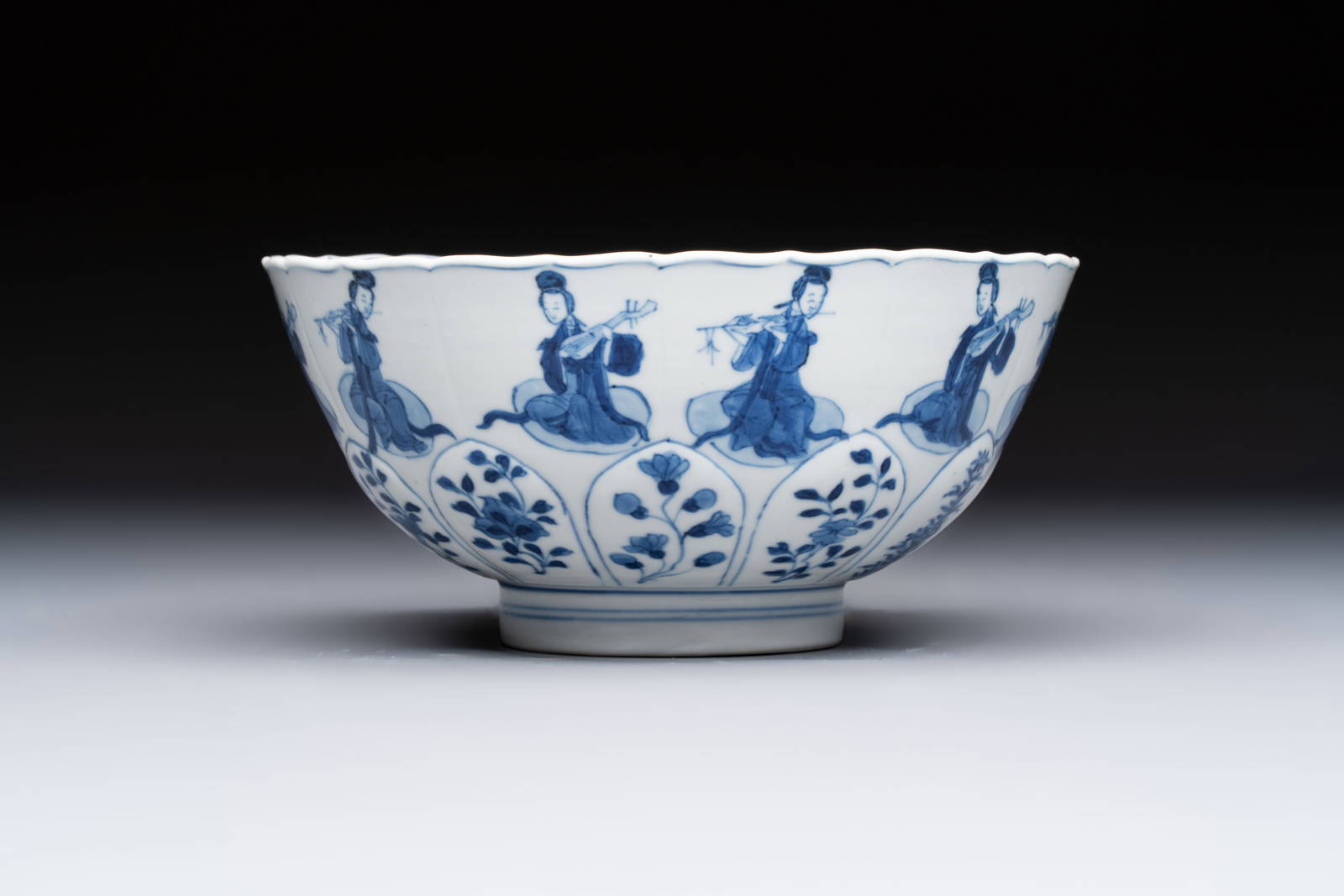A Chinese blue and white moulded 'Elegant Beauties' bowl, Chenghua mark, Kangxi