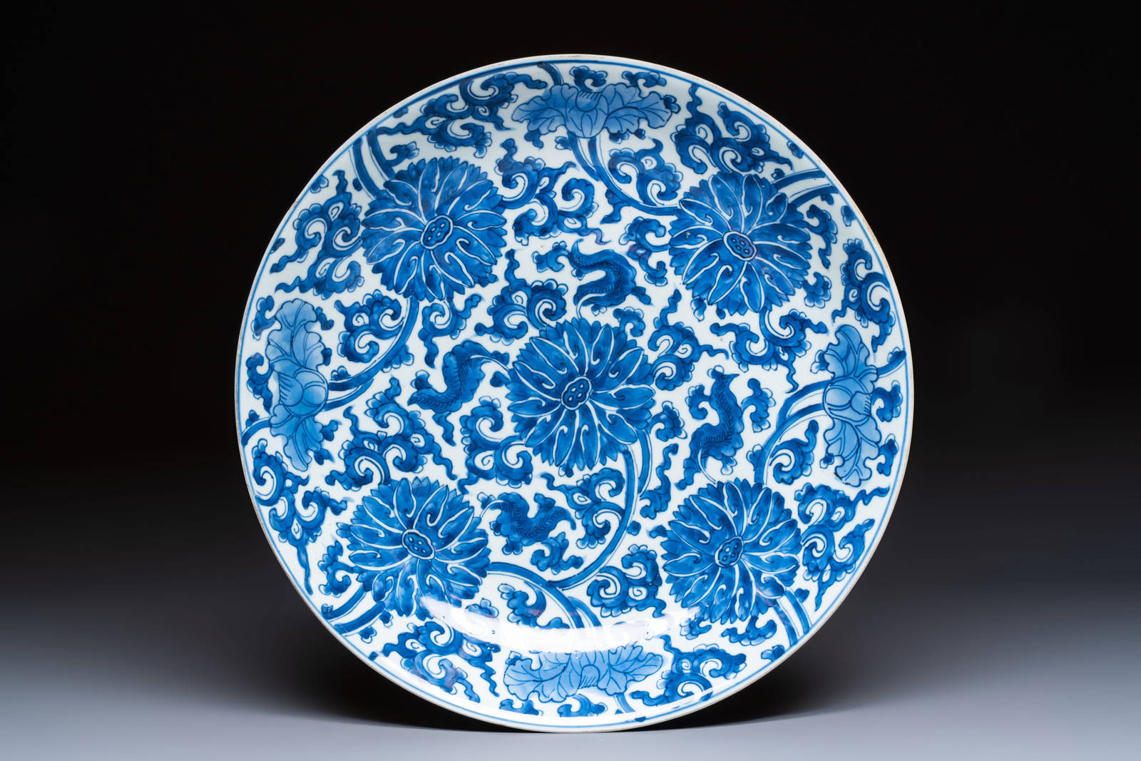A large Chinese blue and white 'Lotus Scroll' dish, Kangxi