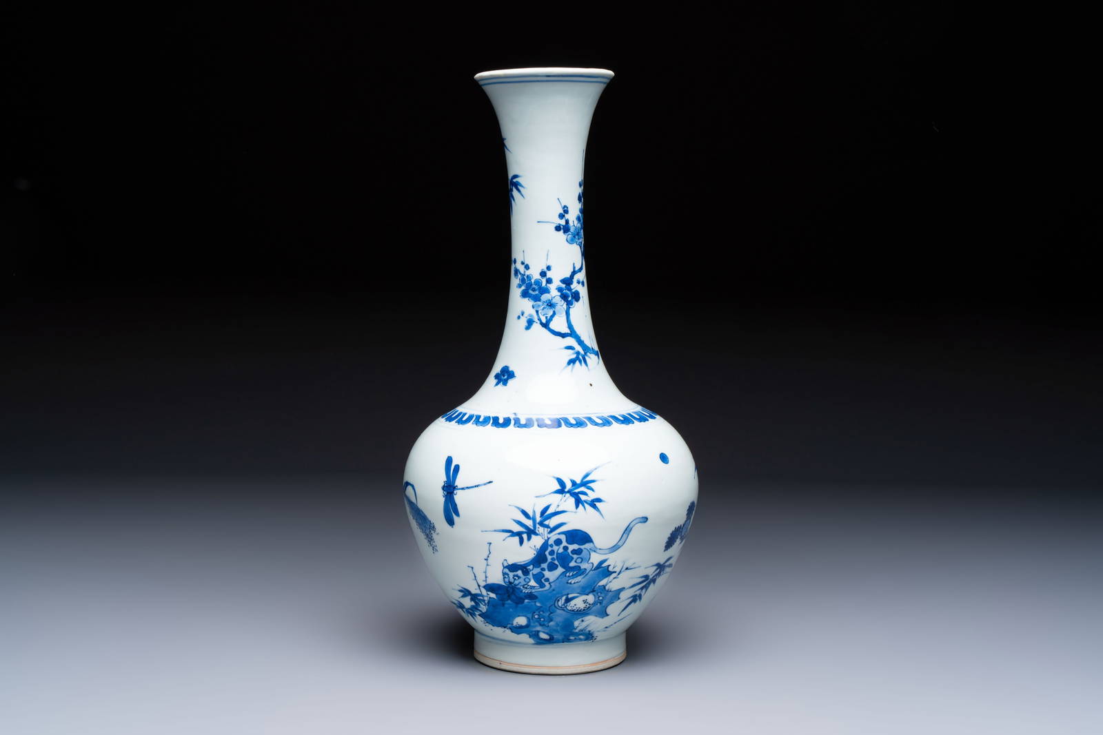 A rare Chinese blue and white 'Cat and Butterfly' bottle vase, Transitional period