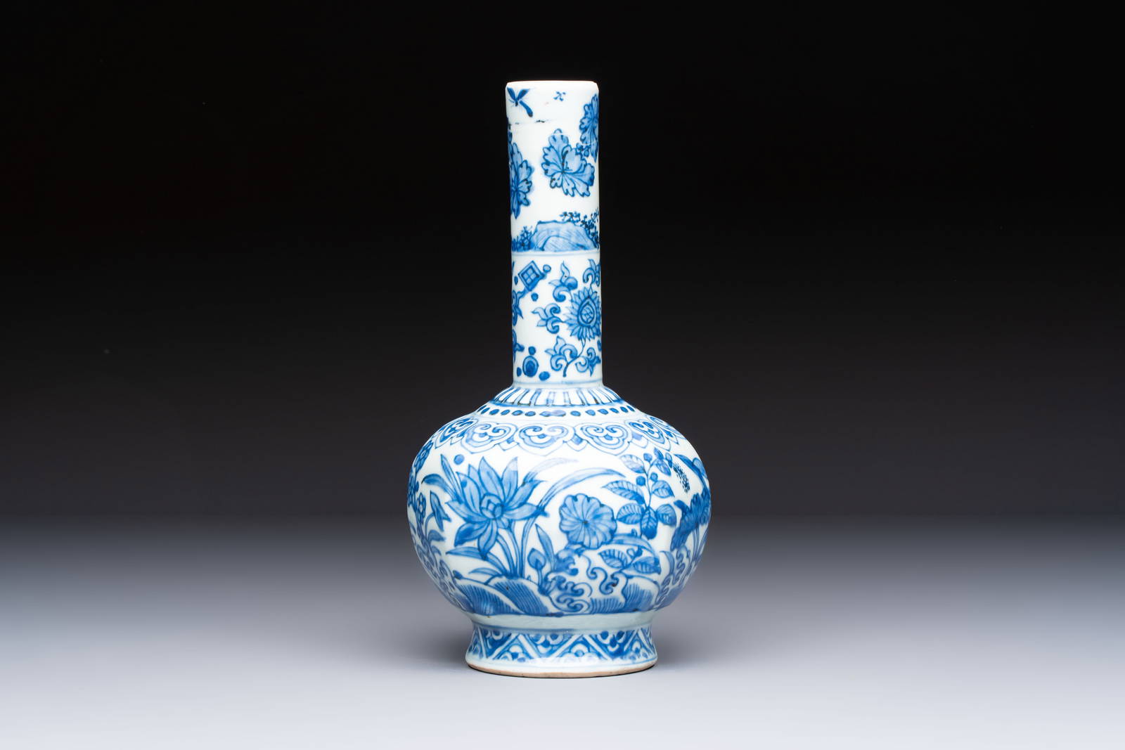 A Chinese blue and white bottle vase with floral design, hare mark, Wanli