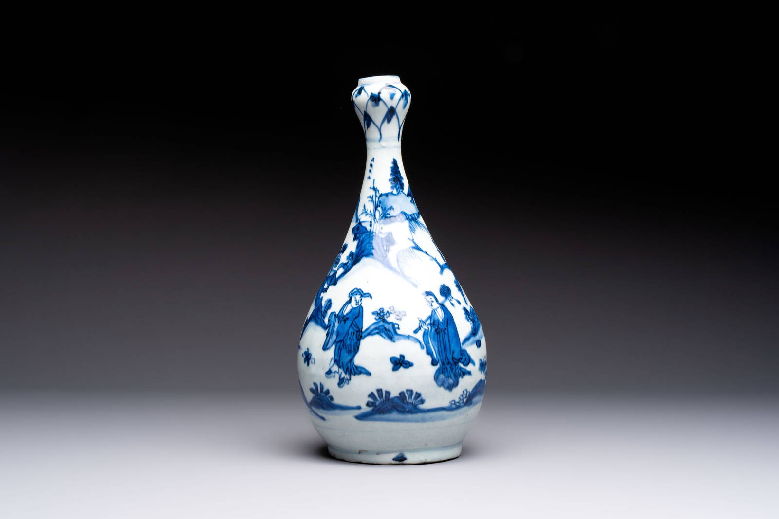 A rare Chinese blue and white 'Immortals' garlic-mouth bottle vase, Liao mark, Wanli/Tianqi