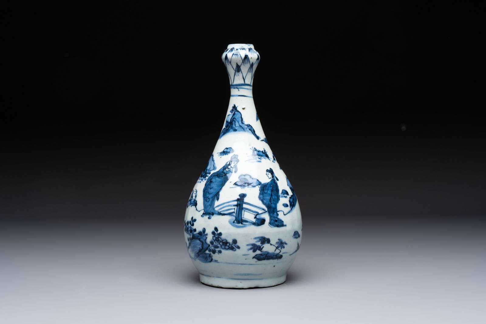 A rare Chinese blue and white 'Immortals' garlic-mouth bottle vase, Wanli/Tianqi