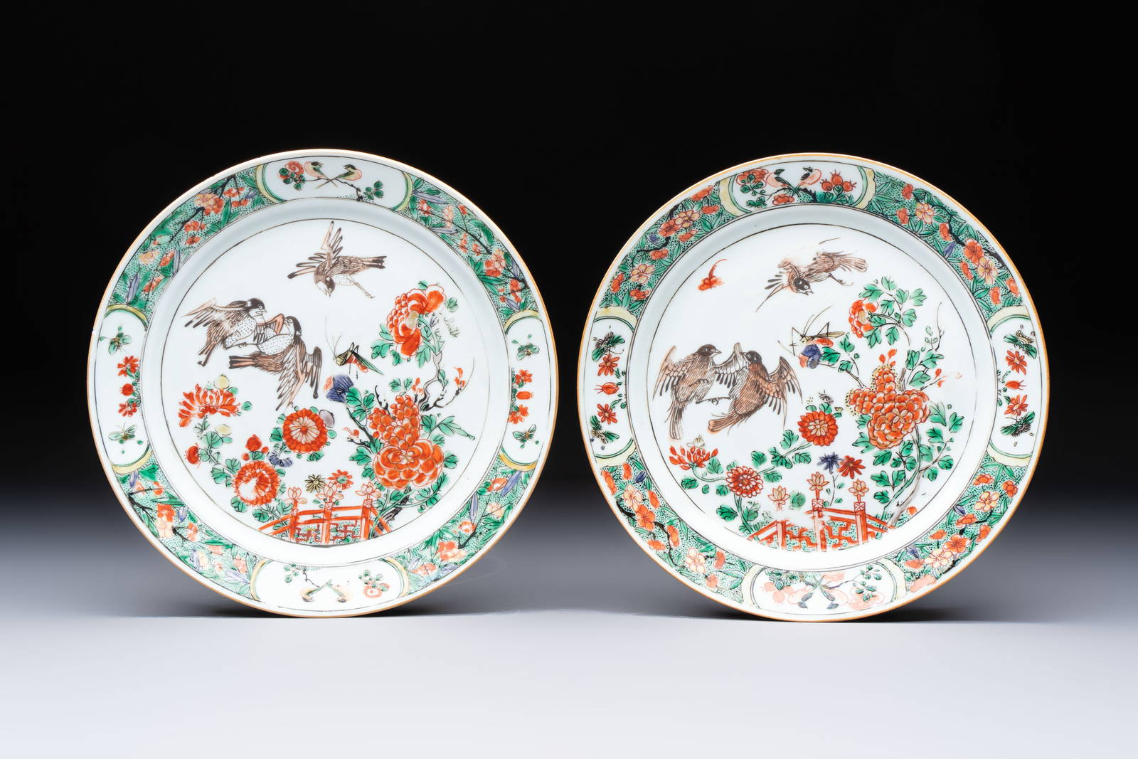 A pair of Chinese famille verte 'Birds Among Flowering Branches' plates, Kangxi