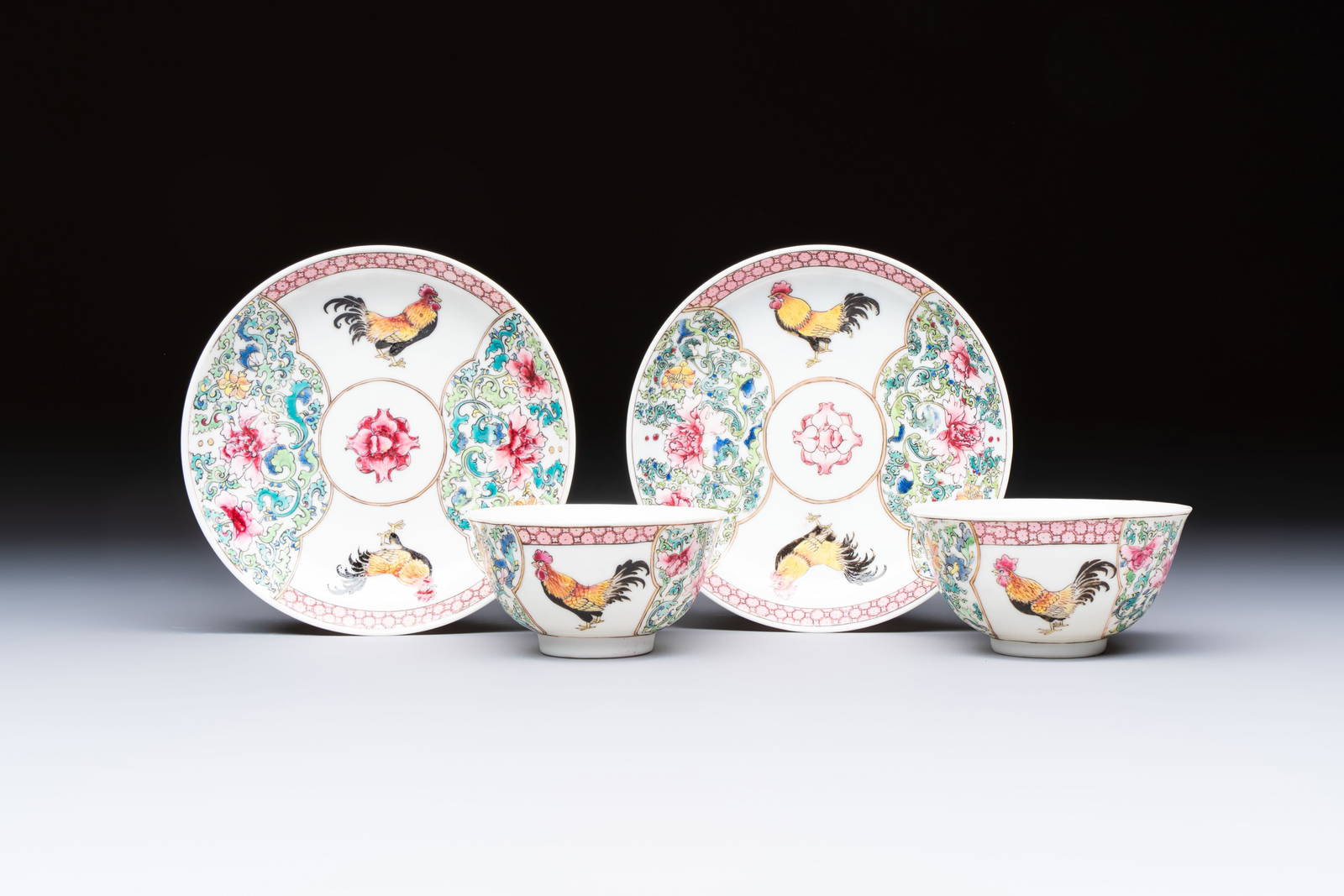 A pair of fine Chinese famille rose 'Rooster' cups and saucers, Yongzheng
