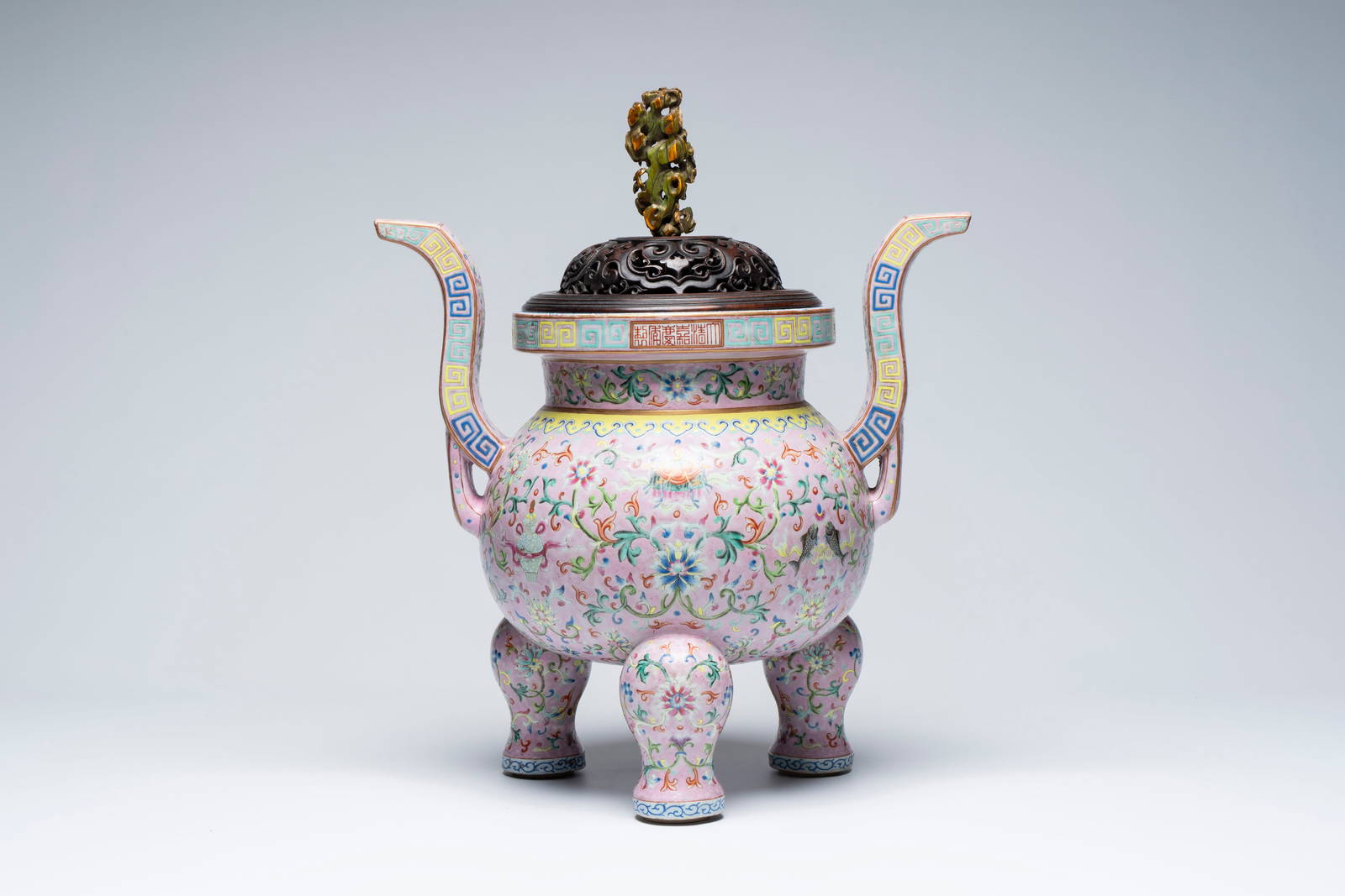 An impressive Chinese famille rose 'Bajixiang and Lotus Scroll' tripod censer with a wooden cover,