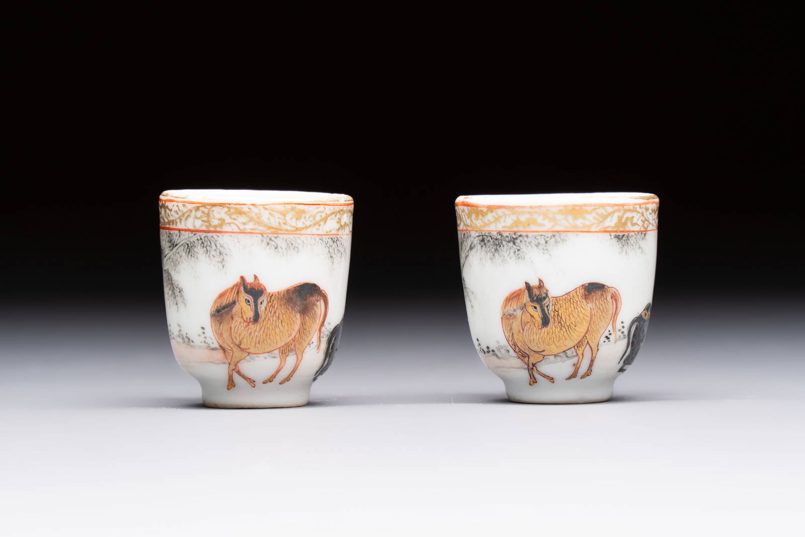 A pair of rare Chinese gilt- and silver-decorated grisaille and iron-red miniature 'Horse' cups,
