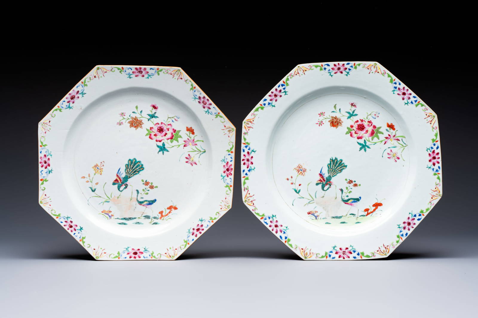 A pair of Chinese famille rose octagonal 'Peacock' dishes, Qianlong