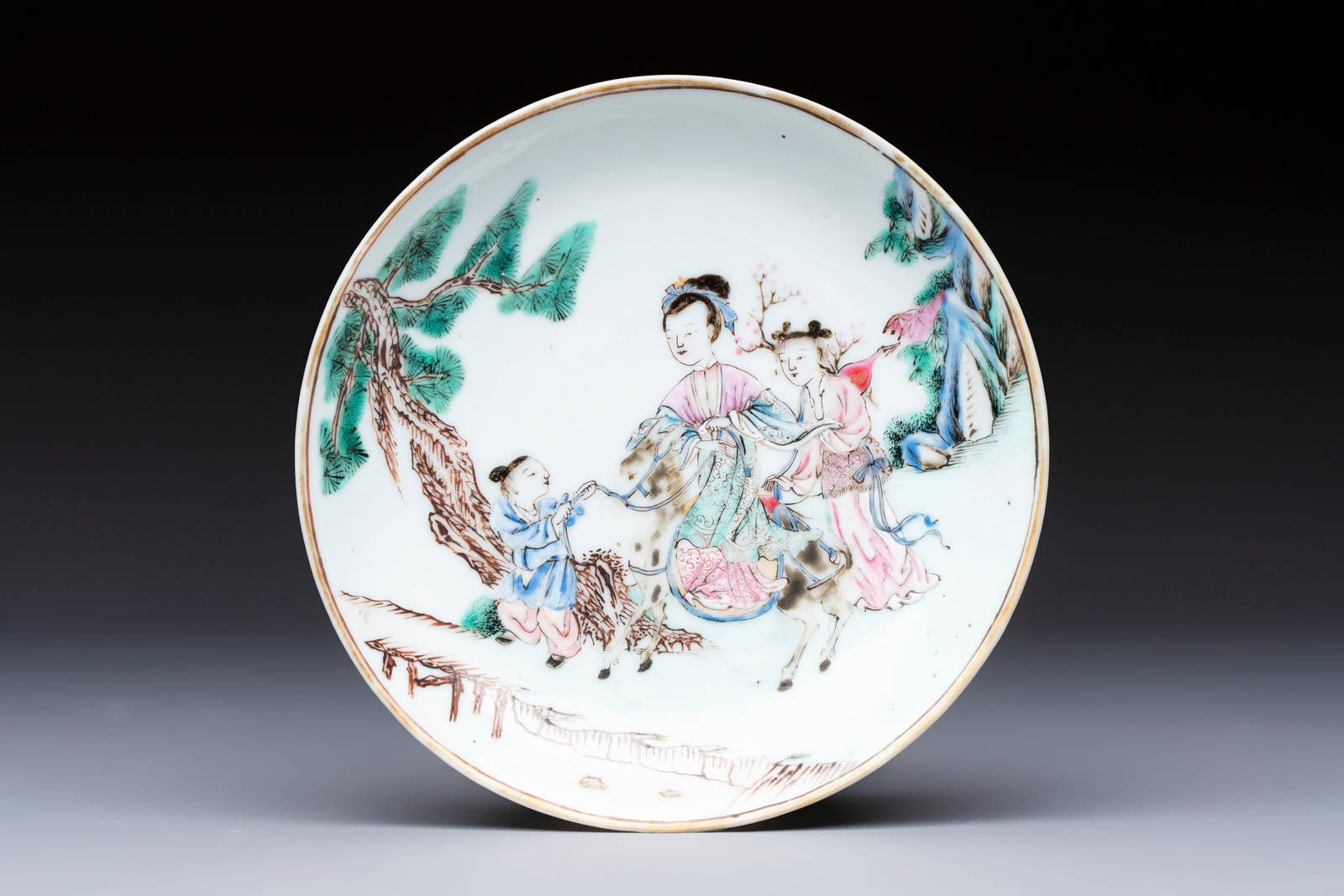 A fine Chinese famille rose 'Elegant Lady on Horseback' saucer, Yongzheng