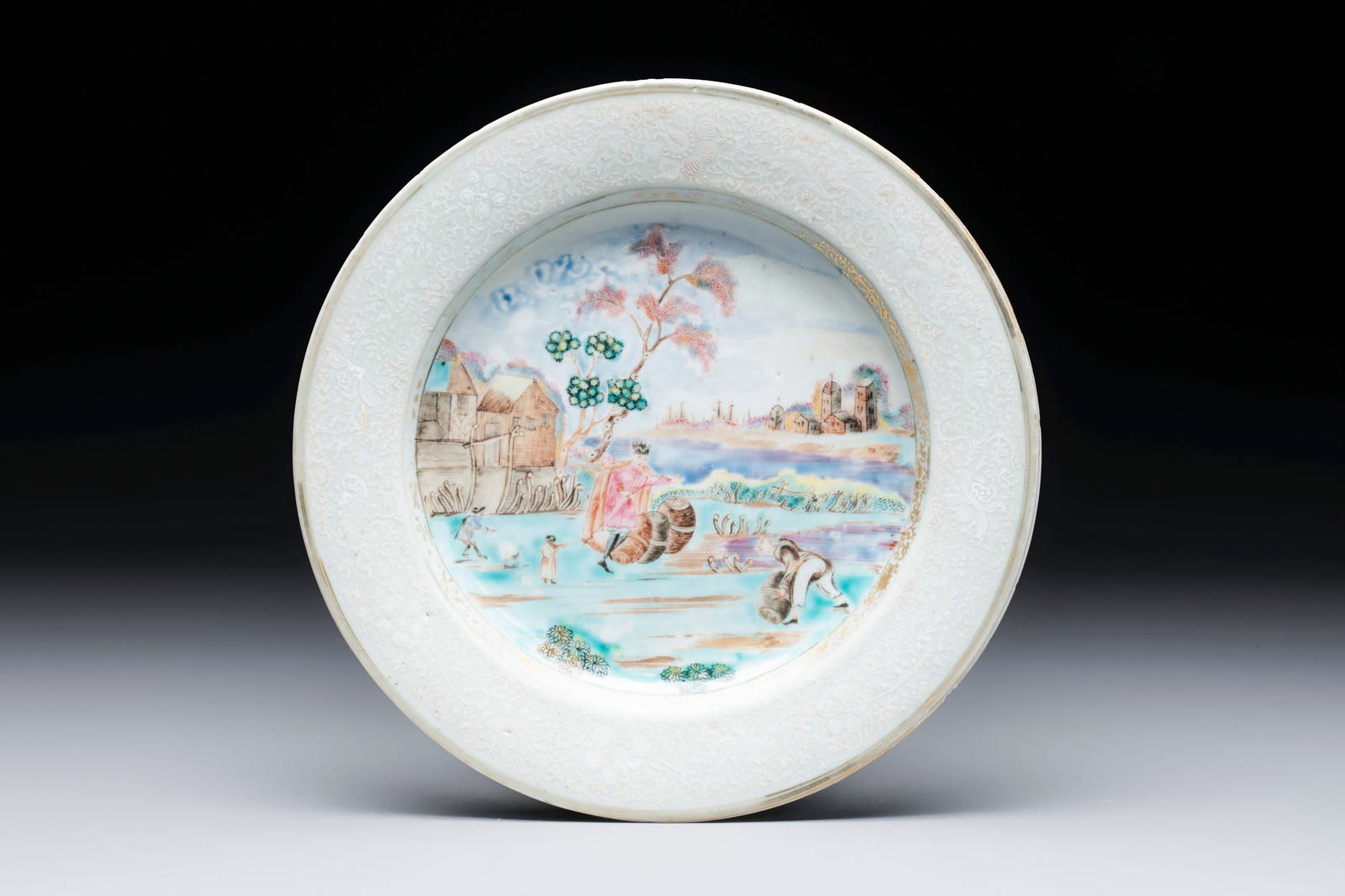 A Chinese famille rose bianco-sopra-bianco 'Peter The Great in Zaandam' plate, Qianlong