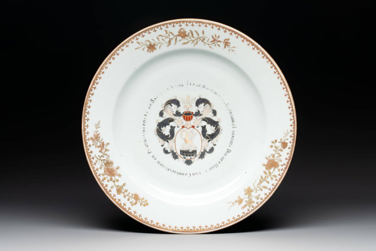 A large Chinese gilt-decorated armorial dish with the arms of Harmannus Laurents Discher, Qianlong,
