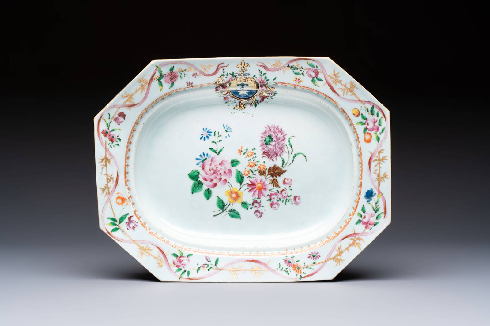 A Chinese famille rose armorial octagonal dish with fine floral design for the French market,