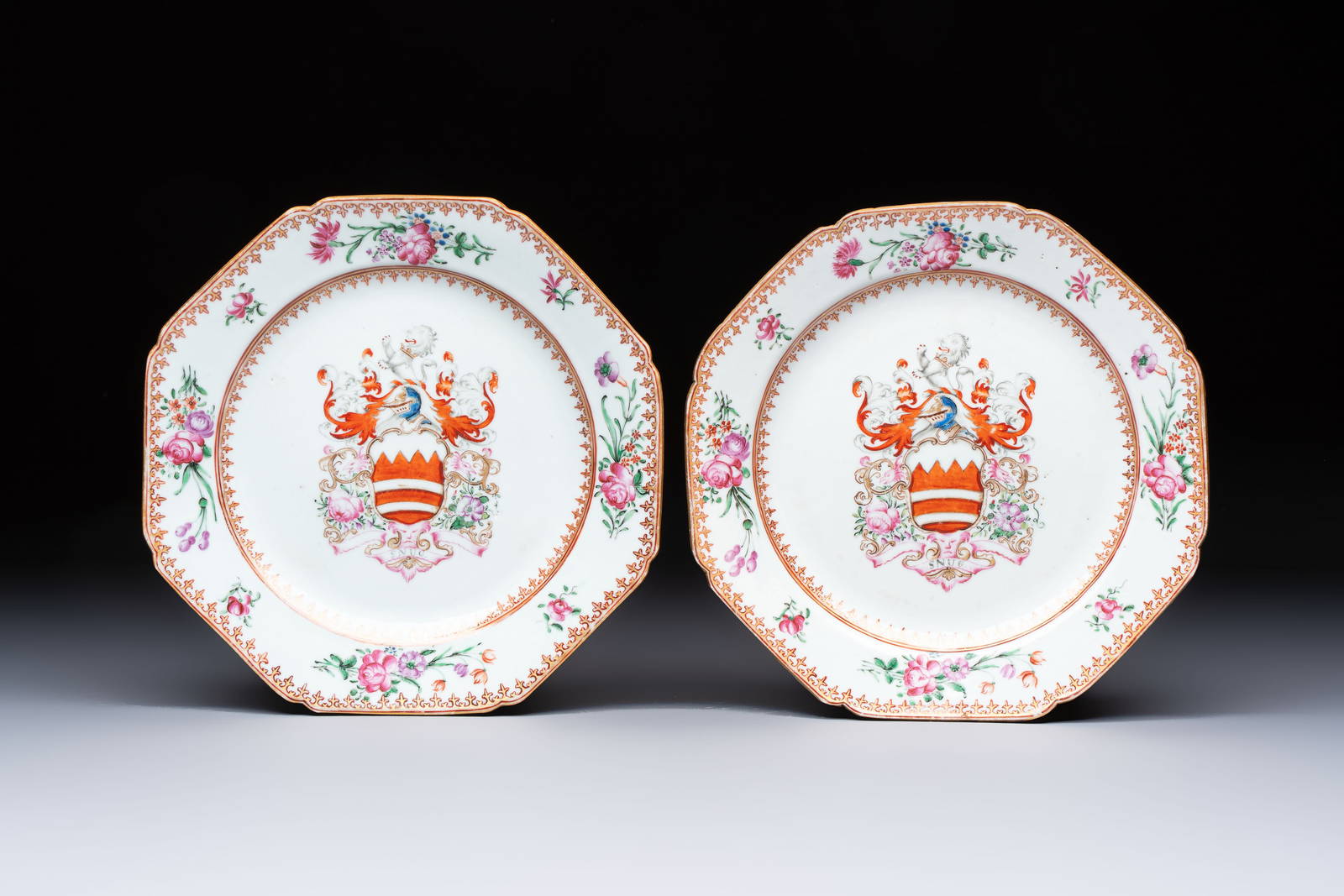 A pair of Chinese famille rose armorial plates with the arms of Hare for the English market,
