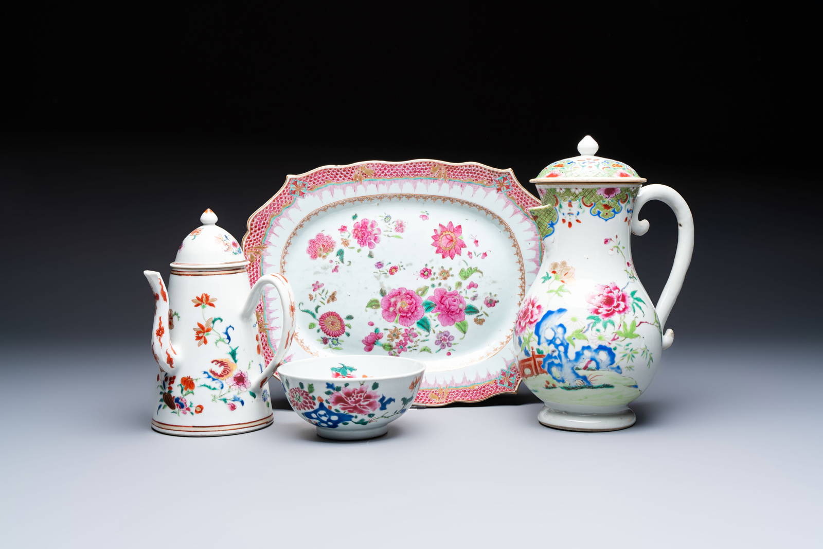 A Chinese famille rose covered ewer, a covered chocolate pot, a bowl and a dish, Qianlong