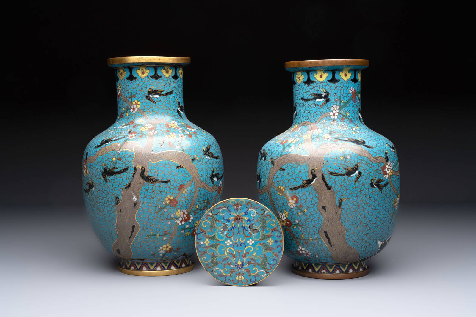 A pair of Chinese cloisonné 'Magpies' vases and a 'Lotus Scroll' plaque, 19th C.