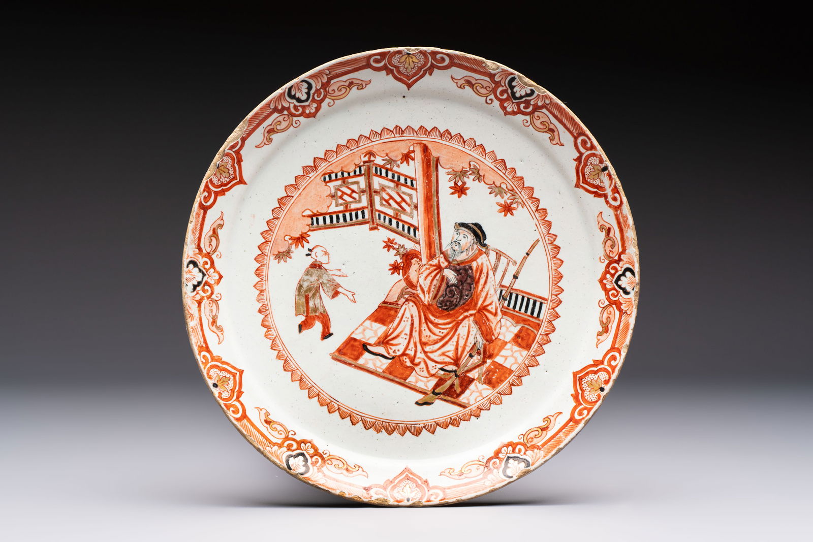 An unusual Dutch Delft dore chinoiserie plate, 1st half 18th C.: An unusual Dutch Delft dore chinoiserie plate, 1st half 18th C. Dia.: 22,6 cm Marked WK on the back for Willem van der Kool, the 'De Drie Porceleyne Flessies' workshop, Delft, 1702-1716 or the widow V