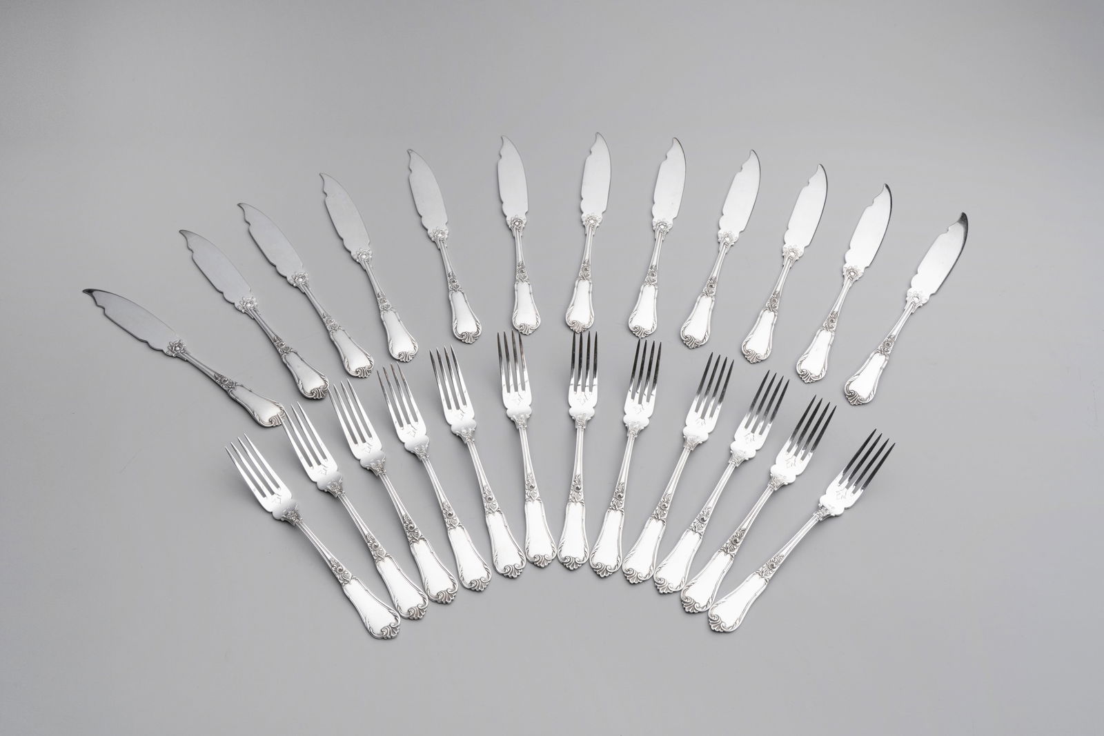 A set of 12 silver fish knives and twelve fish forks, 835/000, Wolfers Freres, Brussels, 20th C. (1 of 3)