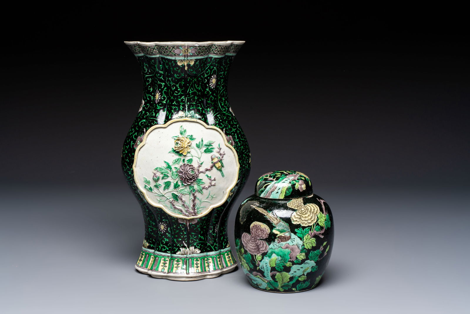 A Chinese verte biscuit black-ground vase and a covered jar, Xuande and Kangxi mark, 19th C. (1 of 7)