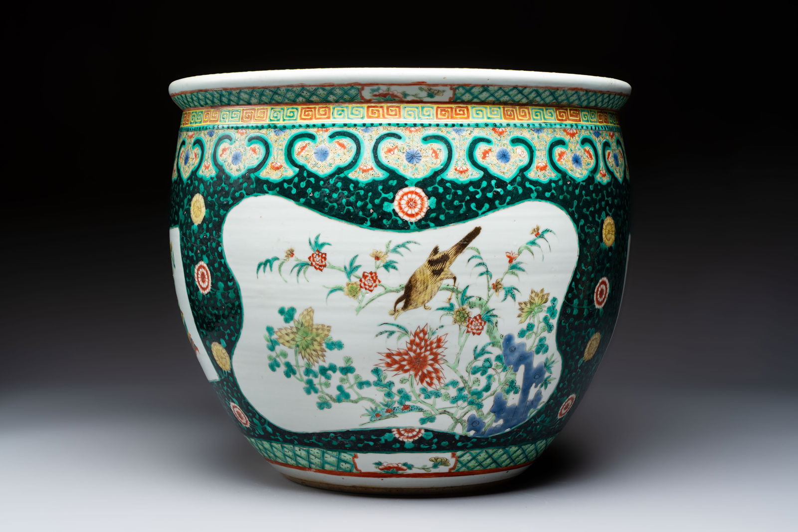 A Chinese famille verte black-ground jardinière with birds, antiquities and flowers, 19th C. (1 of 7)