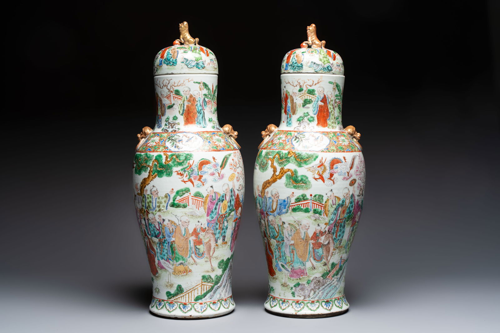 A pair of Chinese famille rose '18 Luohan' vases and covers, 19th C. (1 of 6)