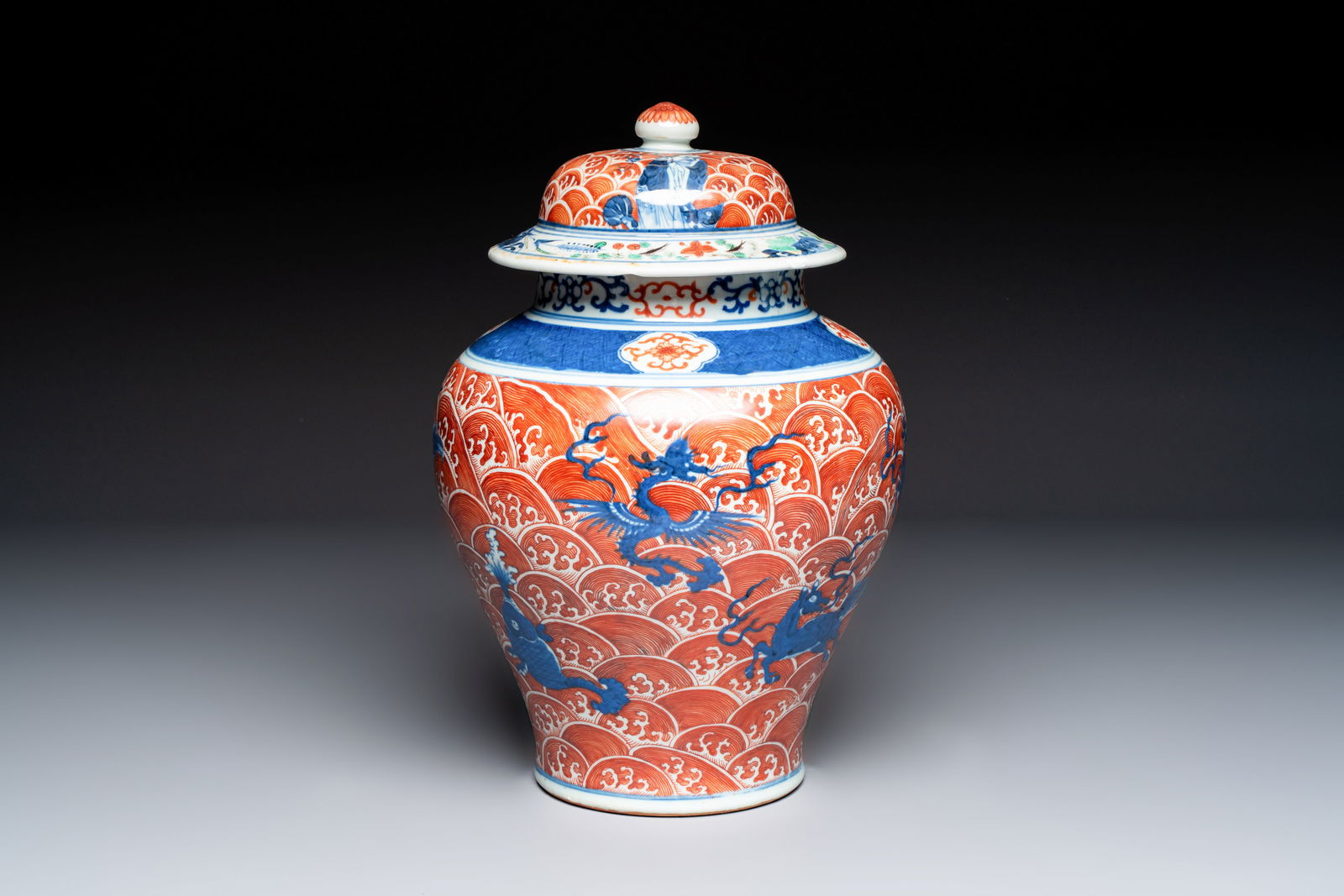 A Chinese blue, white and iron-red decorated 'Mythical Animals' vase and cover, 19th C. (1 of 7)