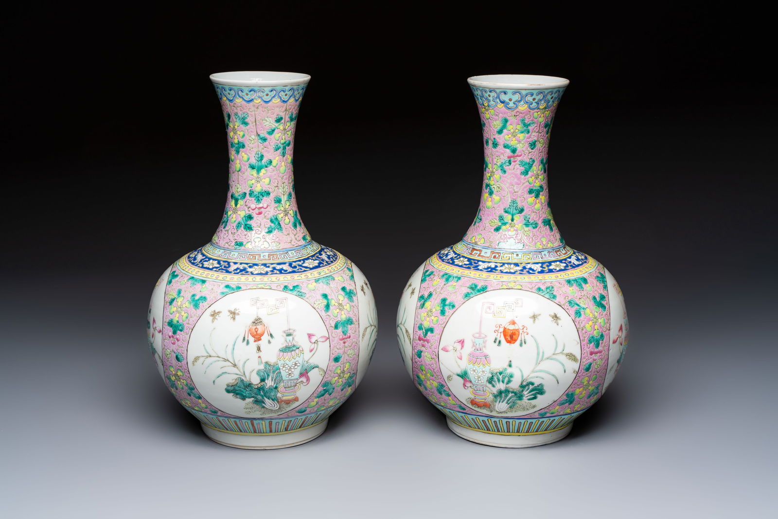 A pair of Chinese famille rose pink-ground 'Ping An Bai Sui' bottle vases, 19th C. (1 of 7)