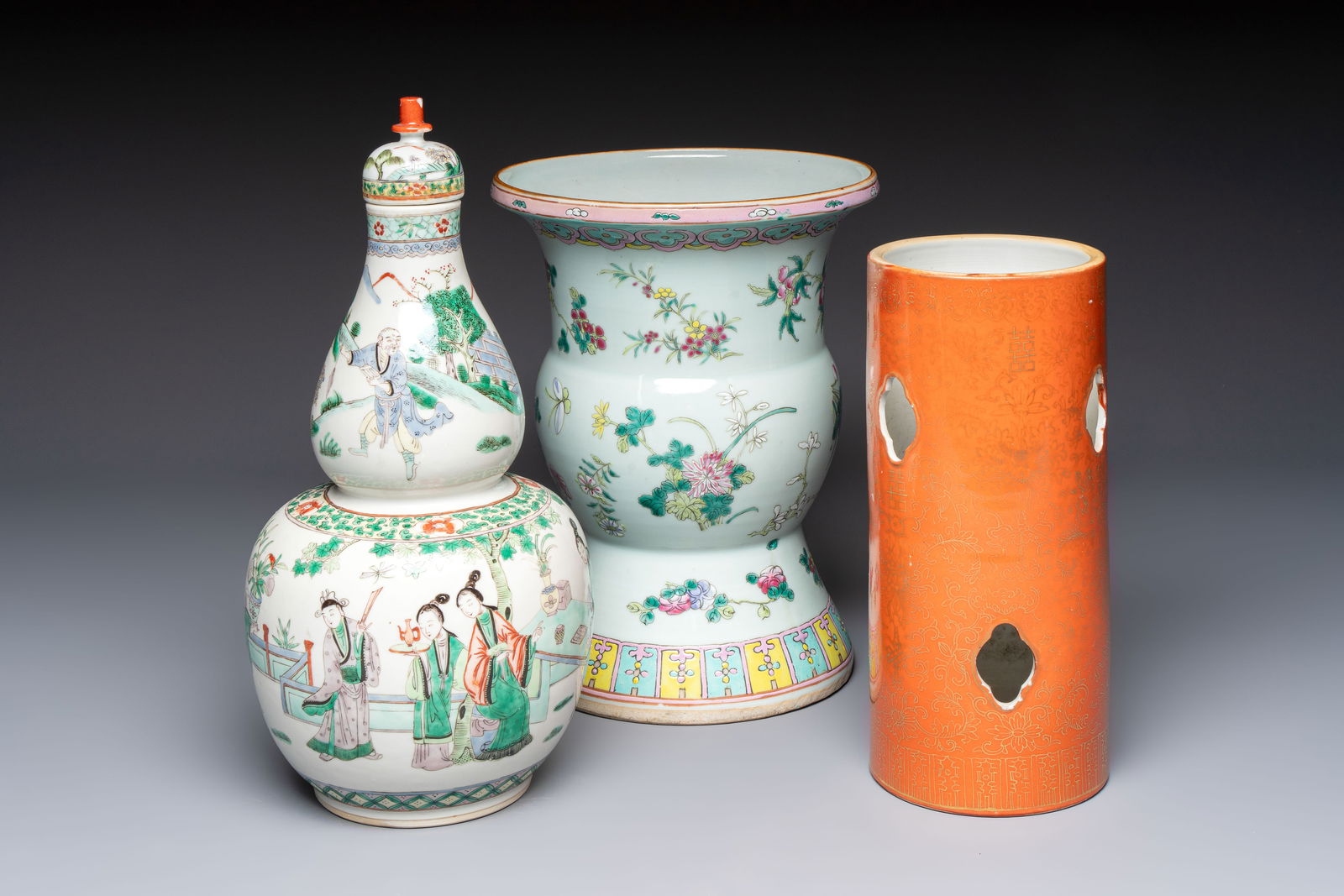 A Chinese famille rose spittoon, a famille verte covered double-gourd vase and a gilt-decorated: A Chinese famille rose spittoon, a famille verte covered double-gourd vase and a gilt-decorated coral-red-ground hat stand, Daoguang mark, 19th C. H.: 38 cm (the vase, incl. cover) H.: 29,5 cm (the ha