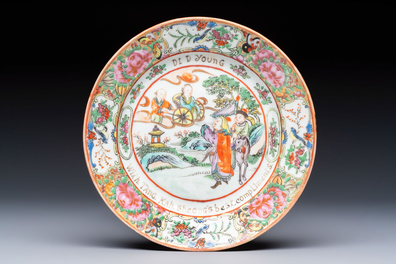 A rare Chinese Canton famille rose saucer inscribed 'Dr. D. Young', 19th C.: A rare Chinese Canton famille rose saucer inscribed 'Dr. D. Young', 19th C. Dia.: 14,4 cm Provenance: - The Geoffrey Middle Collection, UK. This inscribed Canton famille rose service forms part of a r