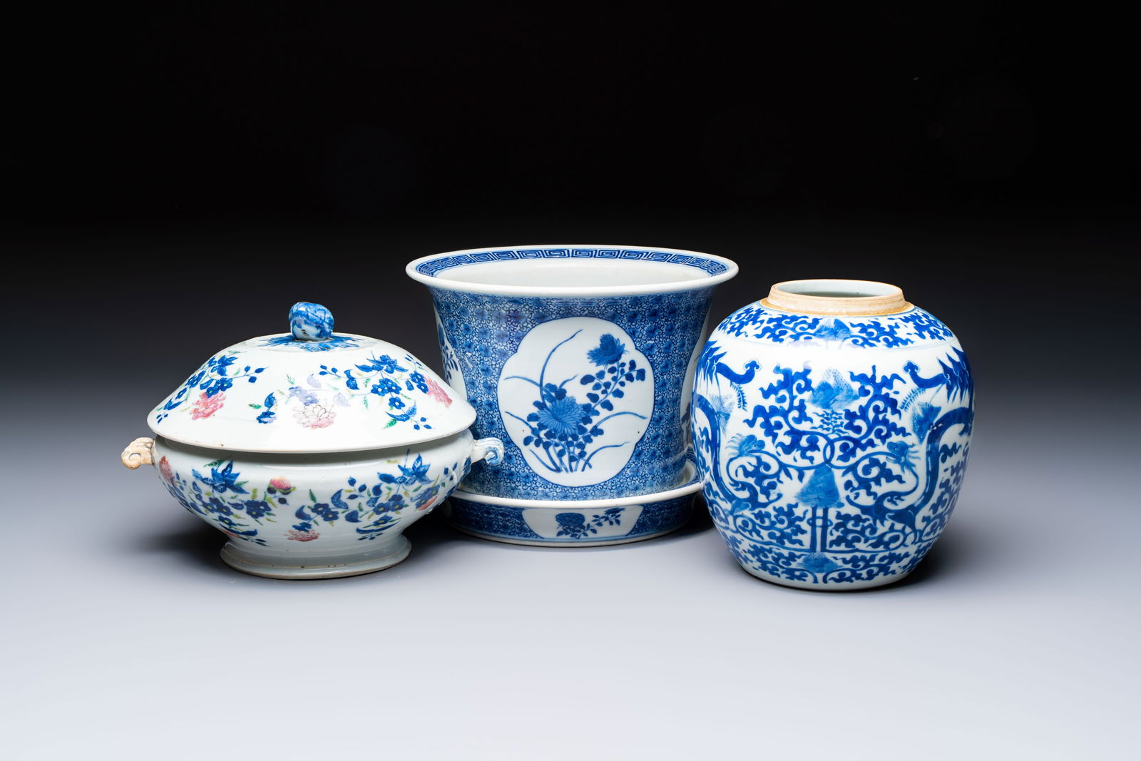 A Chinese blue and white jardinière with stand, a 'Chilong' jar and a famille rose covered tureen, (1 of 13)