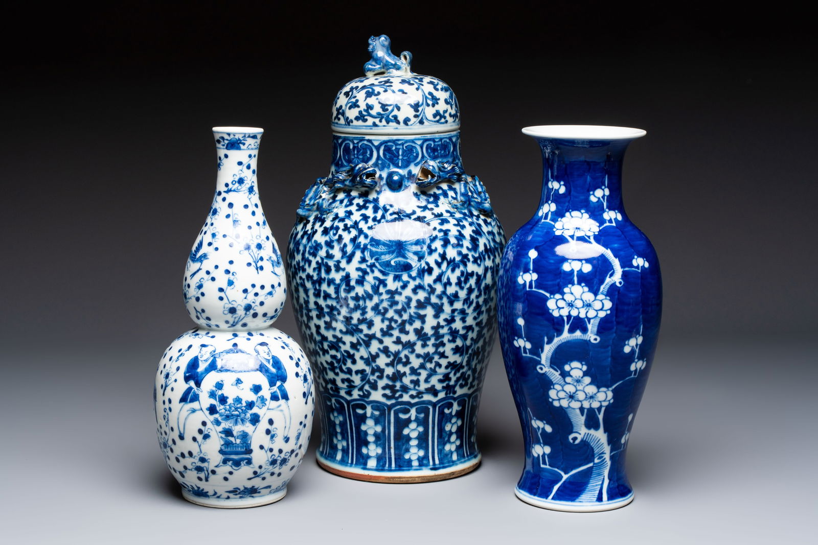 Three Chinese blue and white vases, one covered, Kangxi mark, 19th C. and later (1 of 7)