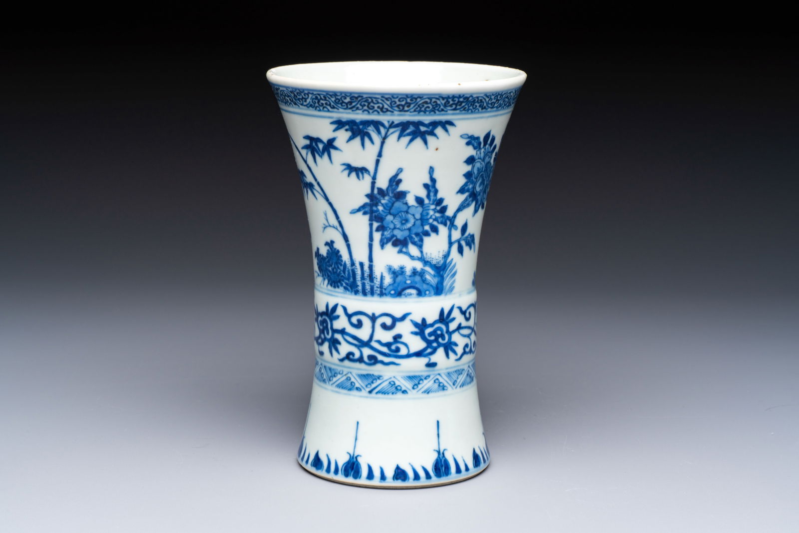 A Chinese blue and white 'Gu' vase with birds among flowering branches, Jiajing mark, 19th C. (1 of 7)