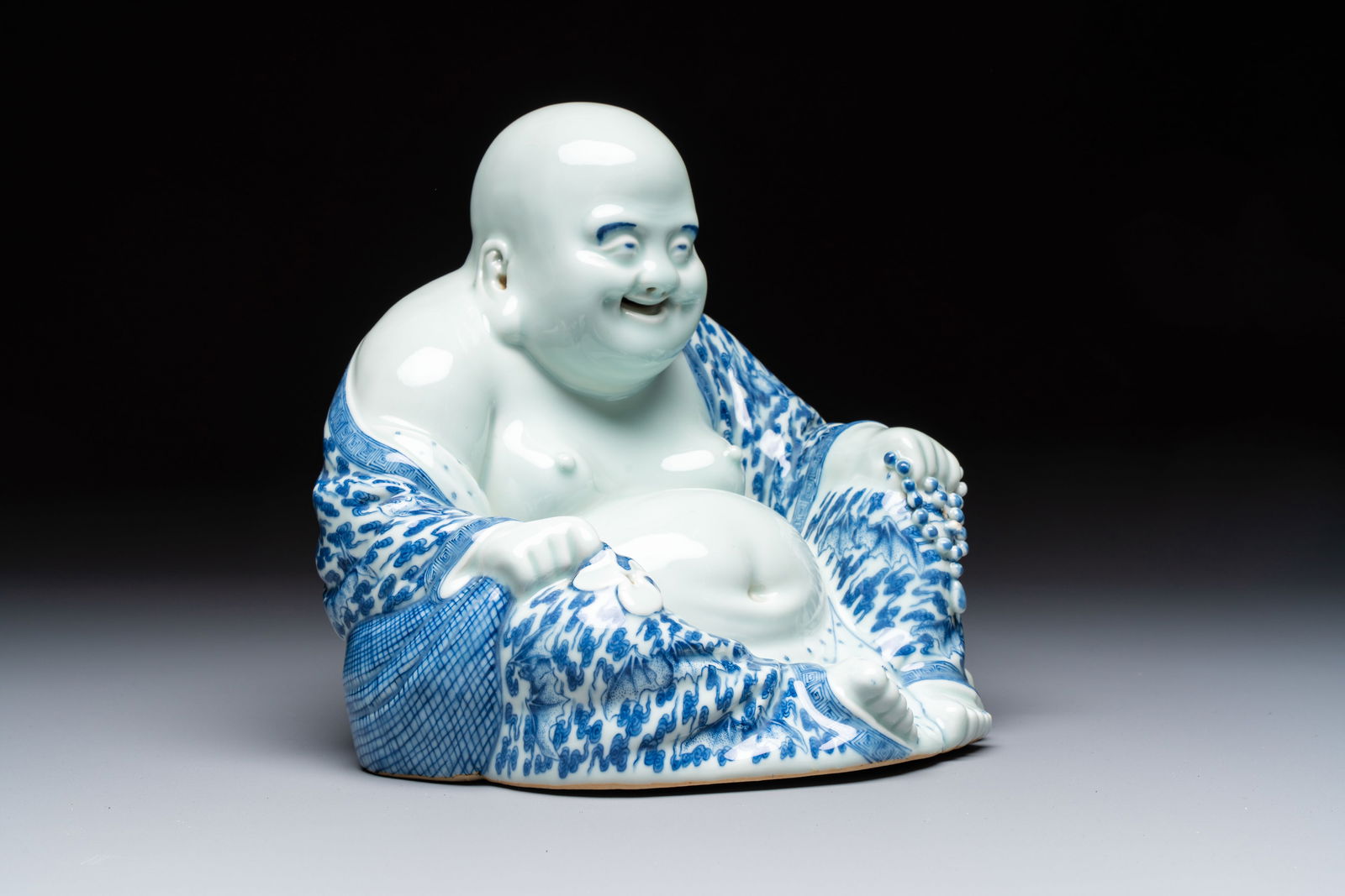 A Chinese blue and white Milefo Buddha, Wei Hongtai mark, 19th C. (1 of 7)