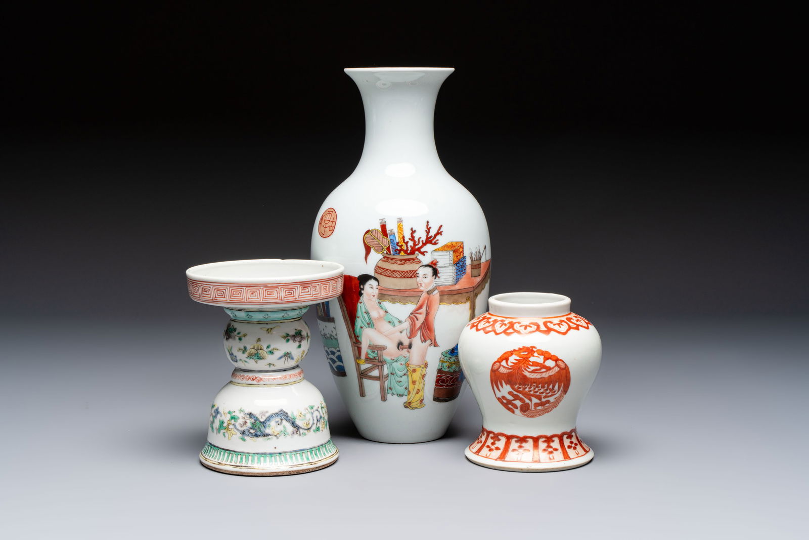 A Chinese polychrome 'Erotic' vase, an iron-red 'Phoenix' jar and a famille verte 'Dragon' stand, (1 of 7)