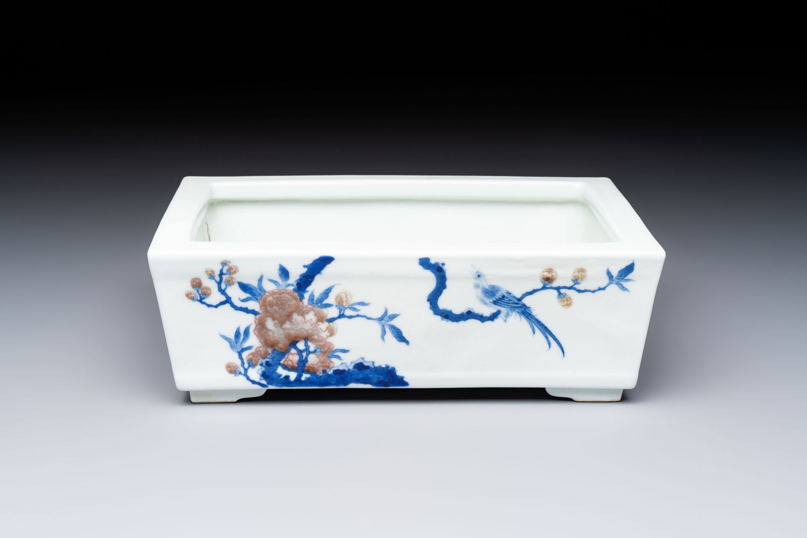 A Chinese blue, white and copper-red rectangular jardinière with birds among flowering branches, (1 of 7)
