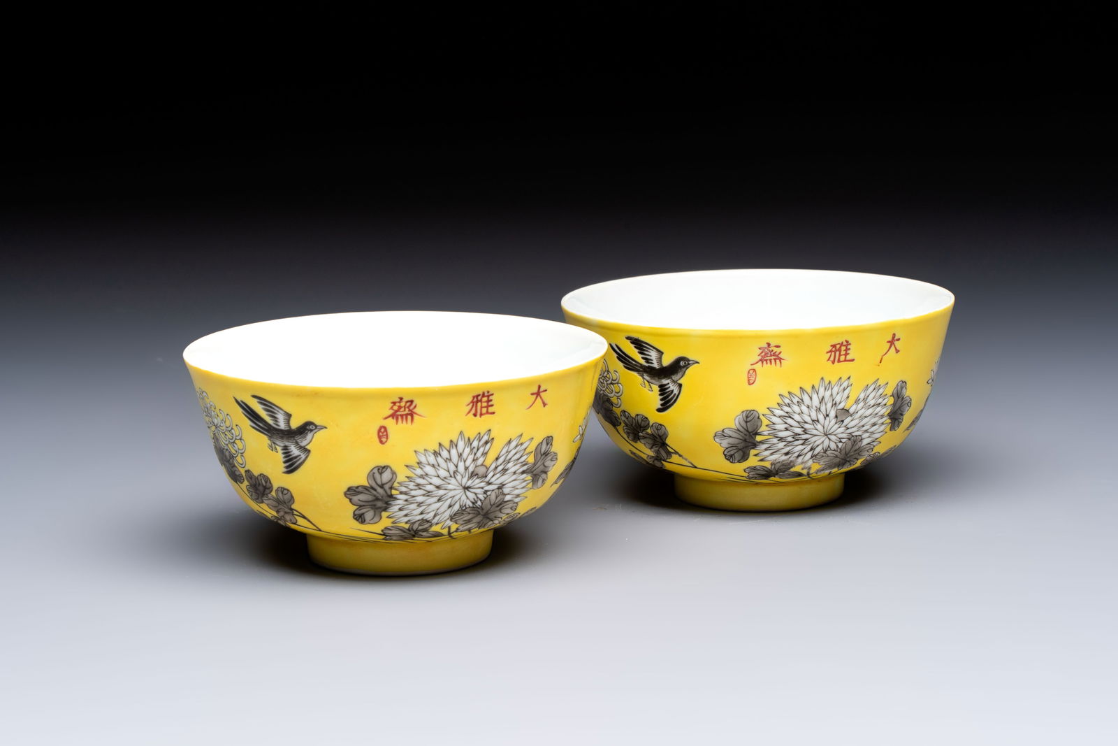 A pair of Chinese grisaille yellow-ground 'Da Ya Zhai' bowls, Yong Qing Chang Chun mark, 20th C. (1 of 7)