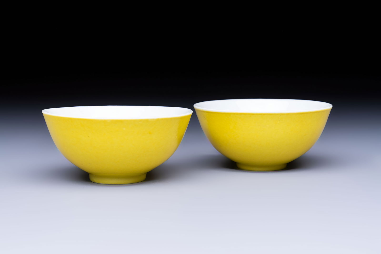 A pair of fine Chinese lemon-yellow-glazed tea bowls, Yongzheng mark, 19th C. (1 of 7)