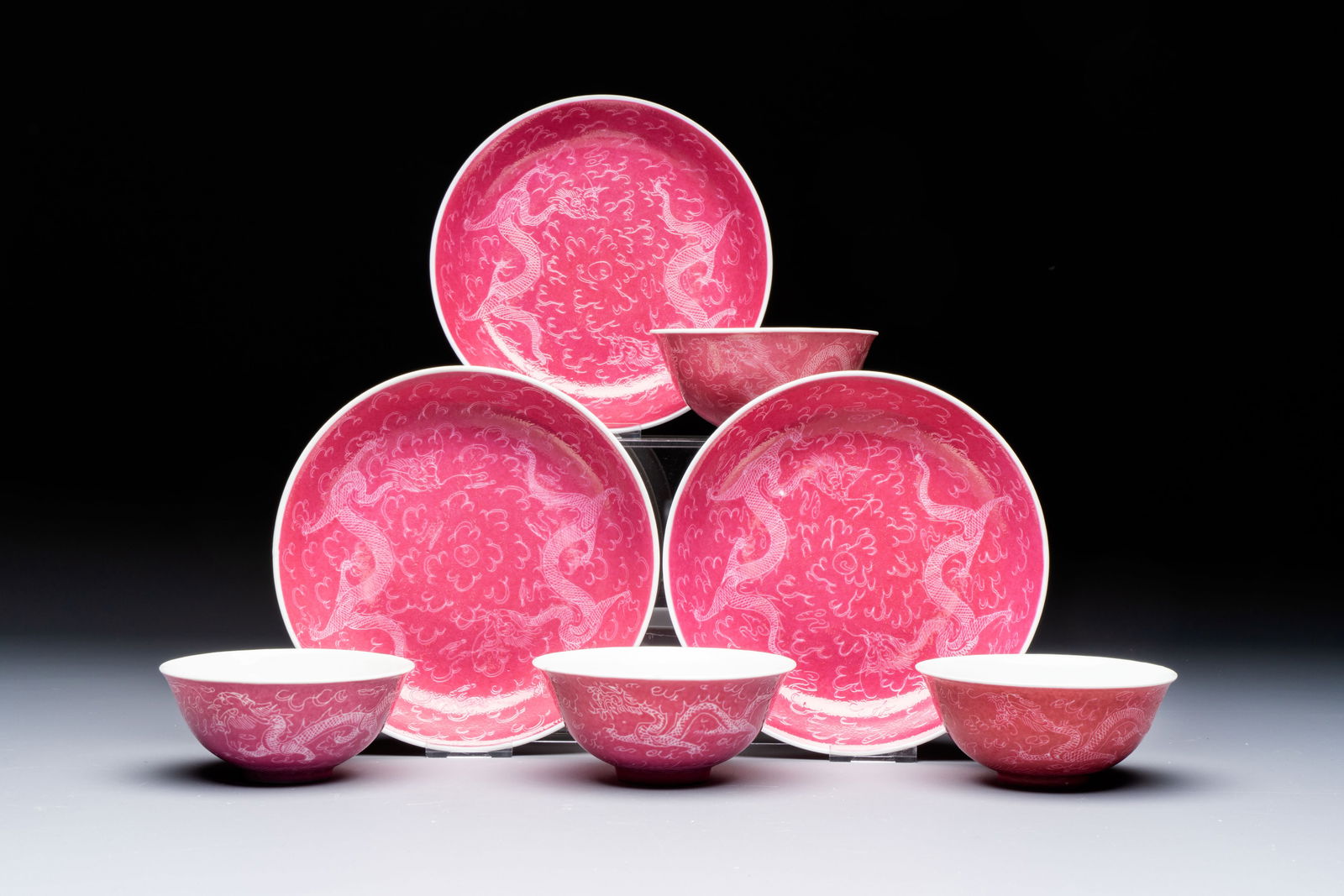 Four Chinese sgraffito ruby-ground 'Dragon' cups and three plates, Qianlong mark, Republic (1 of 9)