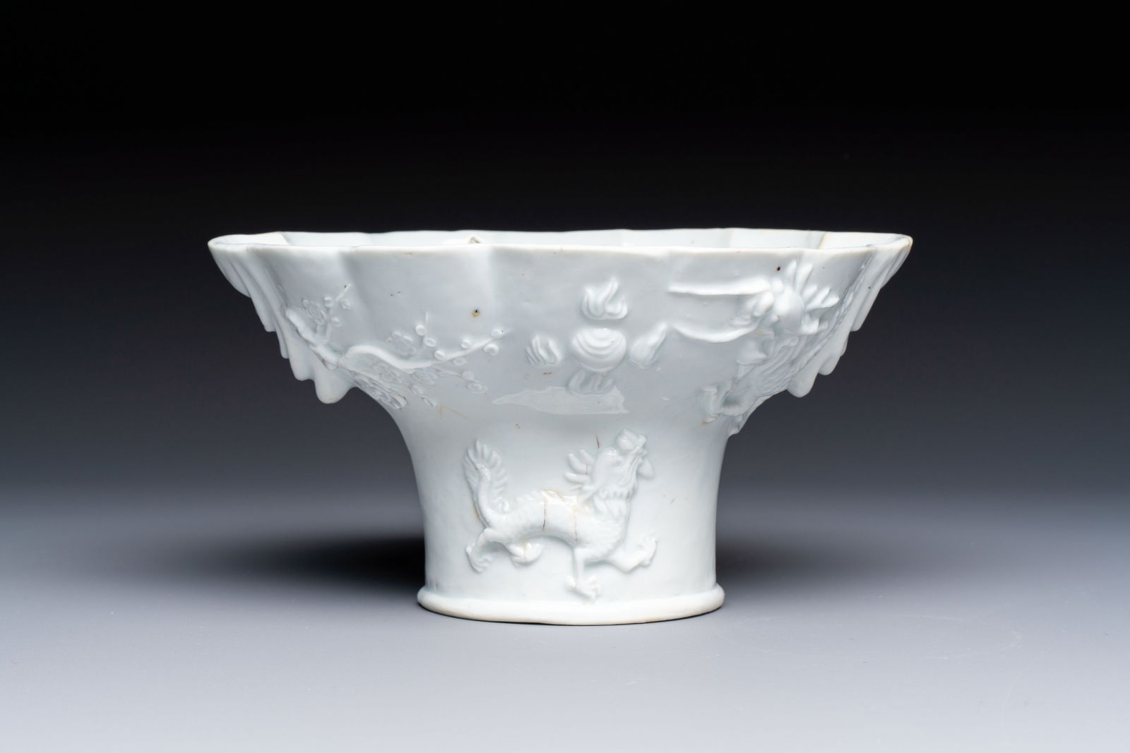 A very large Chinese Dehua blanc de Chine libation cup with a dragon, a qilin, a tiger and a crane, (1 of 8)