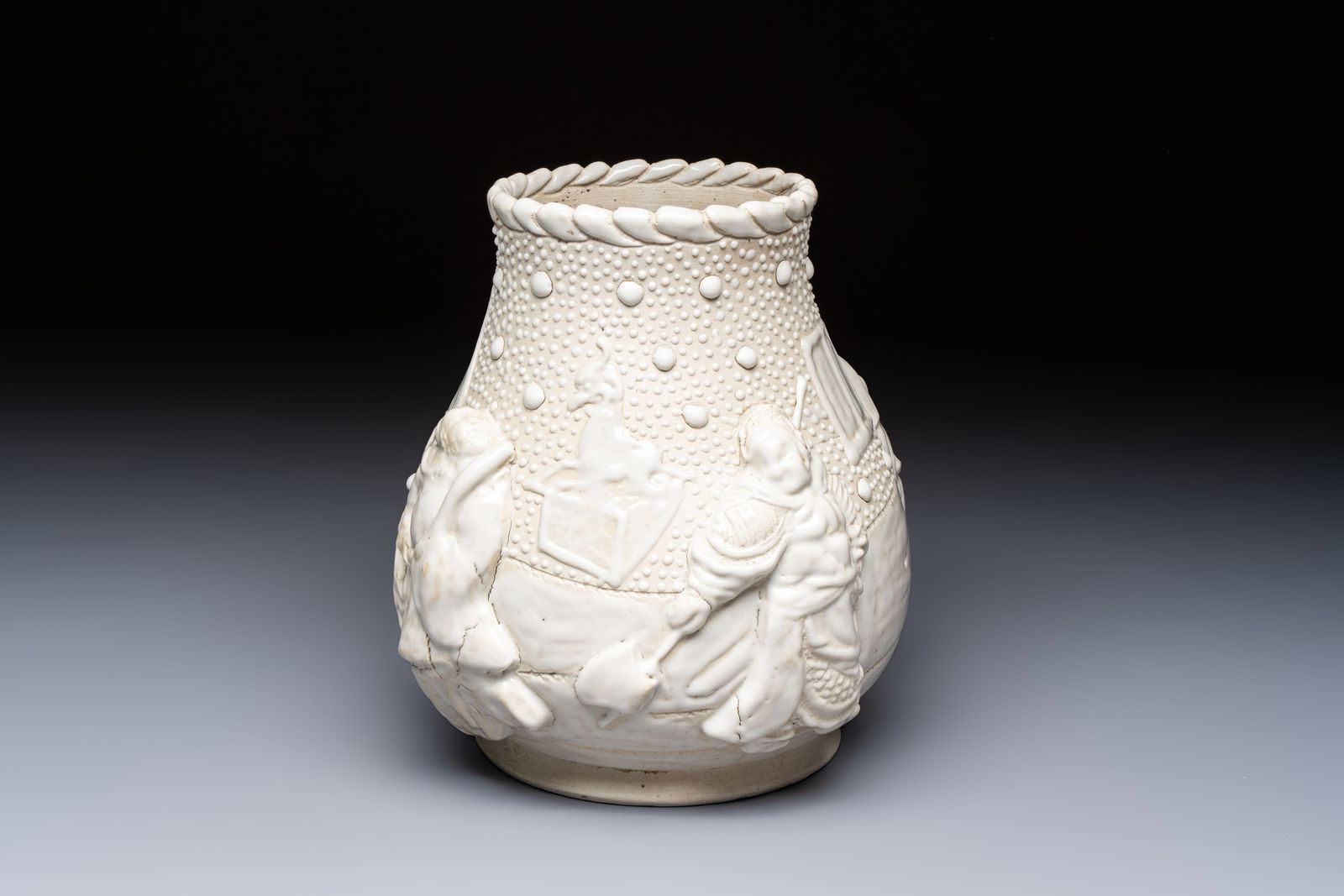 A Chinese Nanking white-glazed 'hu' vase with figural relief design, 19th C. (1 of 7)