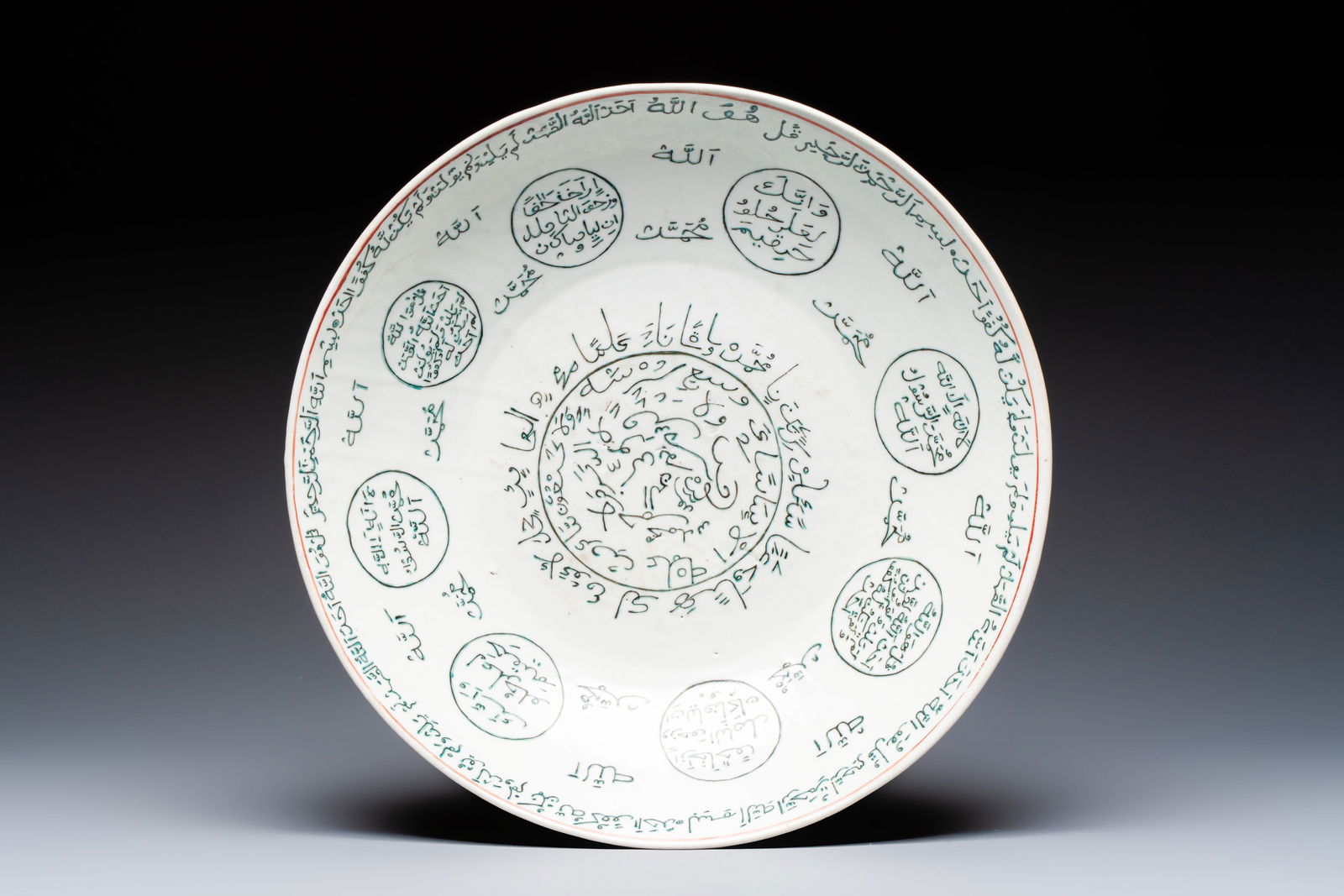 A Chinese Swatow green-enamelled dish with inscriptions for the Islamic market, Ming (1 of 2)