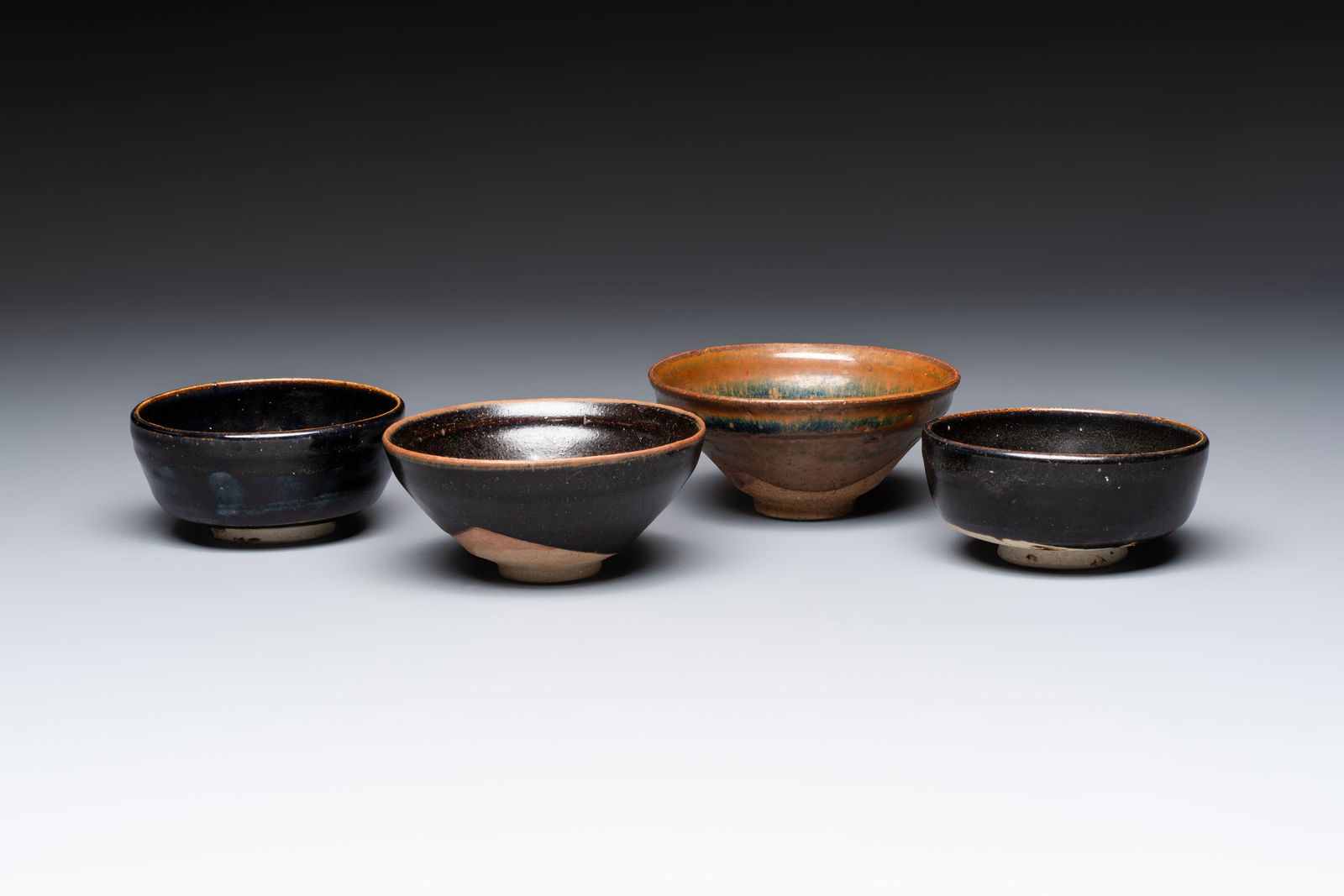 Two Chinese Jian tea bowls and two Dongzhangyao black-glazed tea bowls, Song (1 of 7)